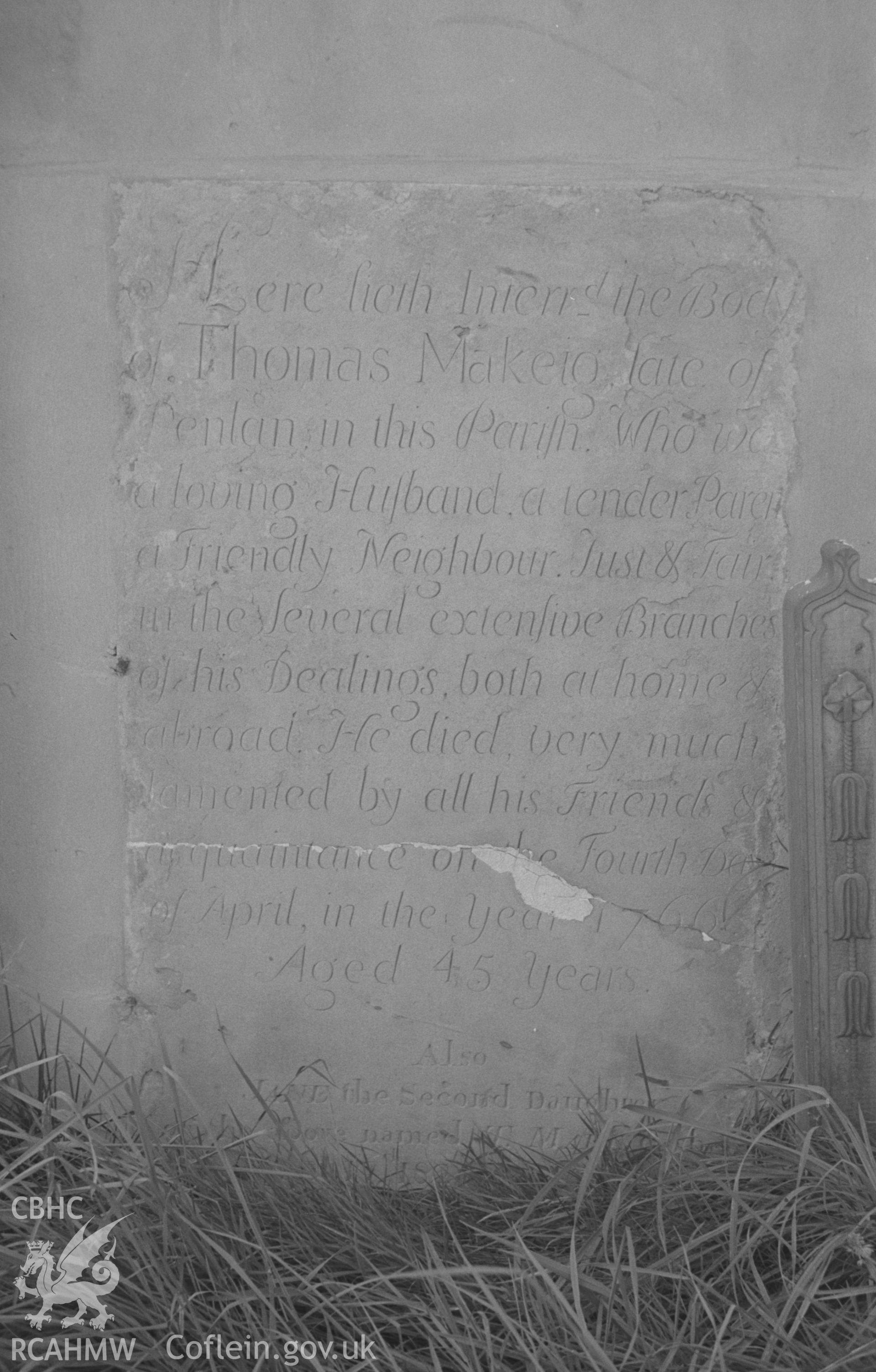 Digital copy of a black and white negative showing 1766 gravestone in memory of Thomas Makeig of Penlan, at St. Tygwydd's church, Llandygwydd, Cardigan. Photographed by Arthur O. Chater in September 1966.
