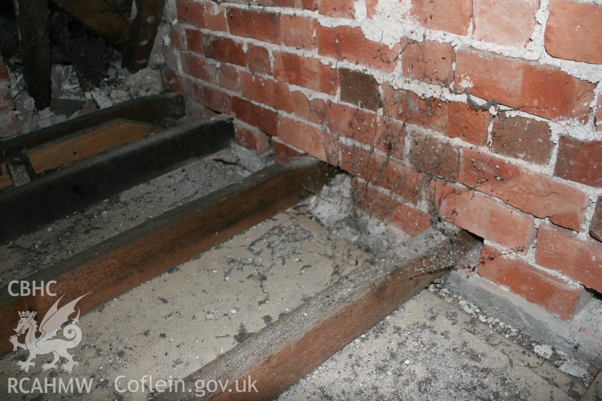Photograph showing detailed interior view of brick wall and wooden beams in the loft of the former Llawrybettws Welsh Calvinistic Methodist chapel, Glanyrafon, Corwen. Taken by Tim Allen on 27/02/2019 to meet a condition attached to planning application.