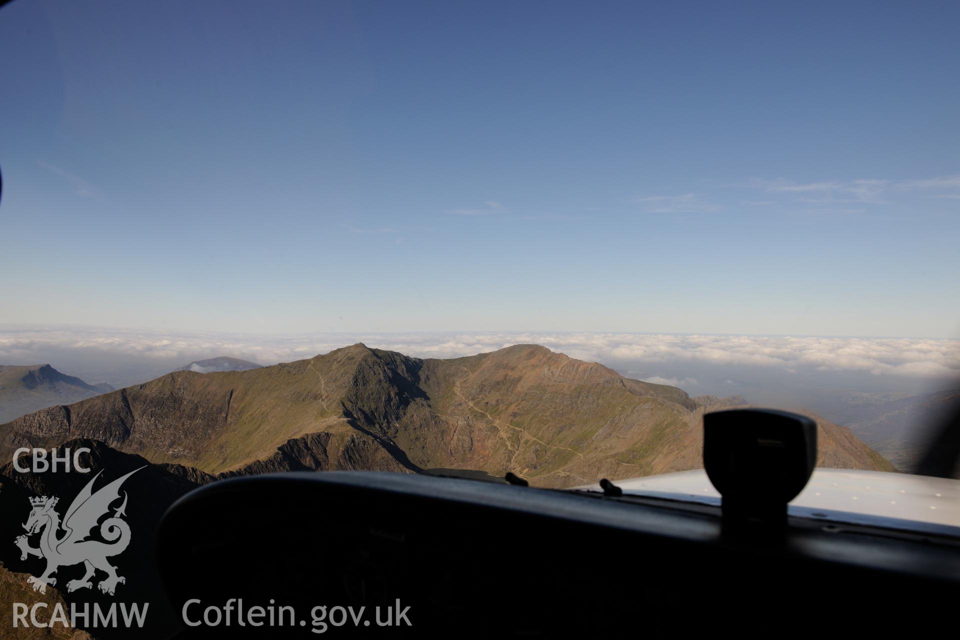 Snowdon Summit and the railway terminus, Snowdonia. Oblique aerial photograph taken during the Royal Commission's programme of archaeological aerial reconnaissance by Toby Driver on 2nd October 2015.