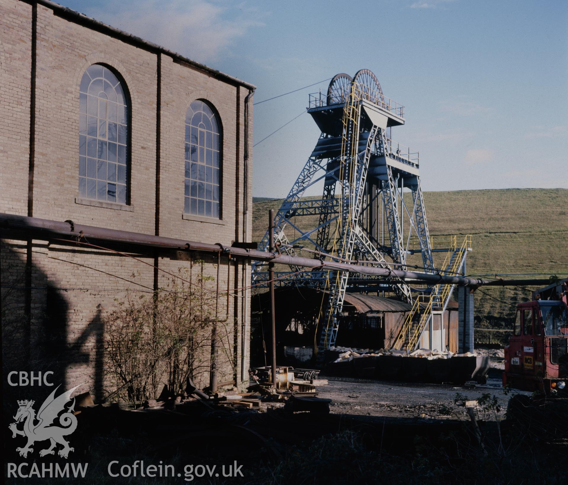 Digital copy of an acetate negative showing surface buildings and pit wheels at St John's Colliery, Maesteg dated 1984, from the John Cornwell Collection.