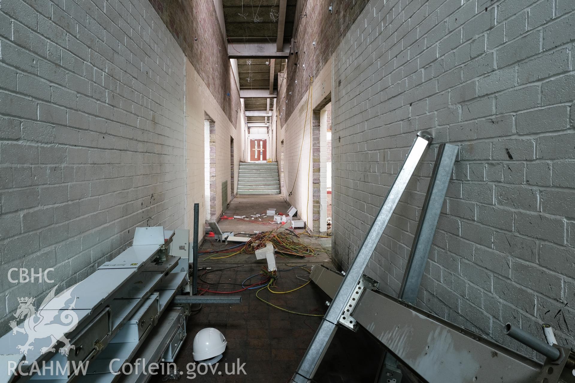 Digital colour photograph showing interior view of corridor at Caernarfonshire Technical College, Ffriddoedd Road, Bangor. Photographed by Dilys Morgan and donated by Wyn Thomas of Grwp Llandrillo-Menai Further Education College, 2019.
