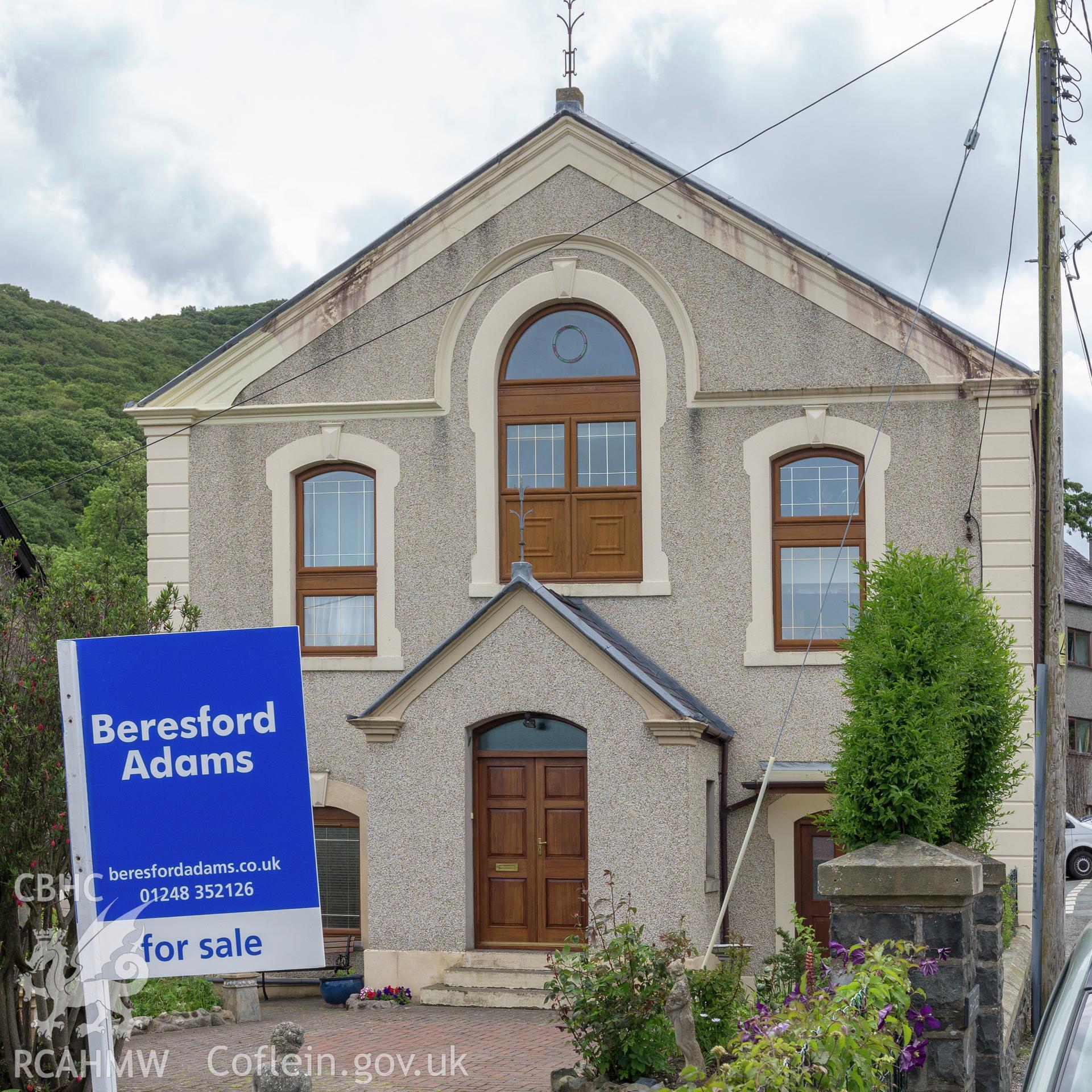 Colour photograph showing front elevation and entrance of Soar Wesleyan Methodist Chapel, Abergwyngregyn. Photographed by Richard Barrett on 15th June 2018.