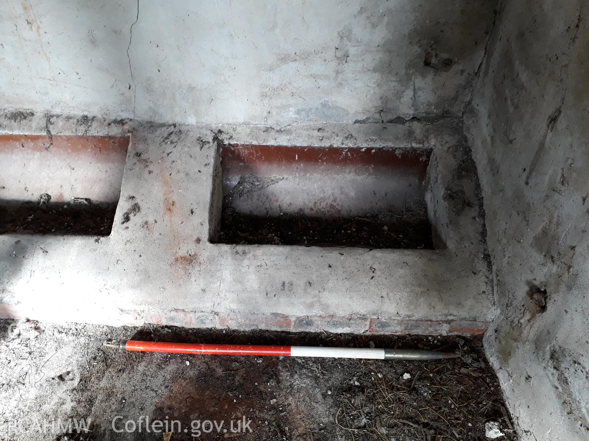 Barn interior animal trough detail, view north-west. 1m scale. Photographed as part of archaeological building recording conducted at Bryn Ysguboriau, Llanelidan, Denbighshire, carried out by Archaeology Wales, 2018. Project no. P2587.