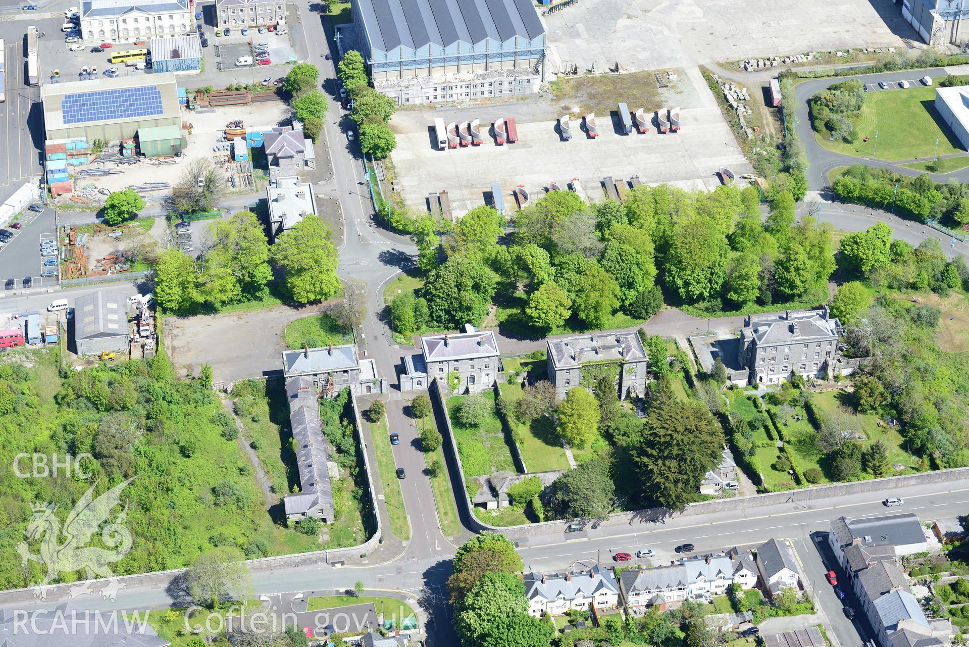 Guard House; RAF Post Office; Coach House; Senior Officers Houses; Capt.Supt.'s House & Port Hotel, Pembroke Dockyard. Oblique aerial photograph taken during Royal Commission?s programme of archaeological aerial reconnaissance by Toby Driver on 13/5/2015.