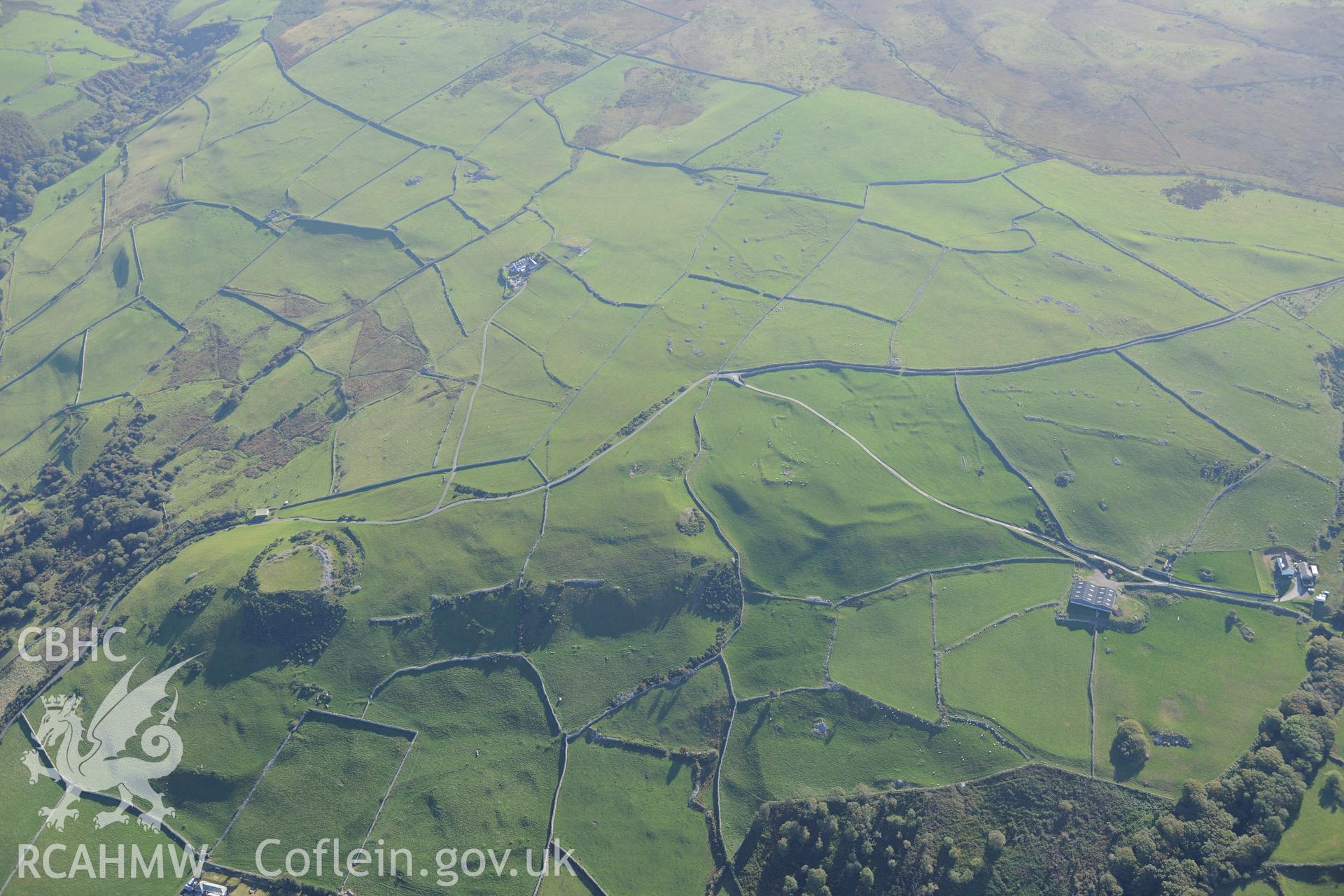 Castell y Gaer, the field system to the west of the Castell, and an enclosure north east of Carn-Gadell Uchaf. Oblique aerial photograph taken during the Royal Commission's programme of archaeological aerial reconnaissance by Toby Driver on 2nd October 2015.