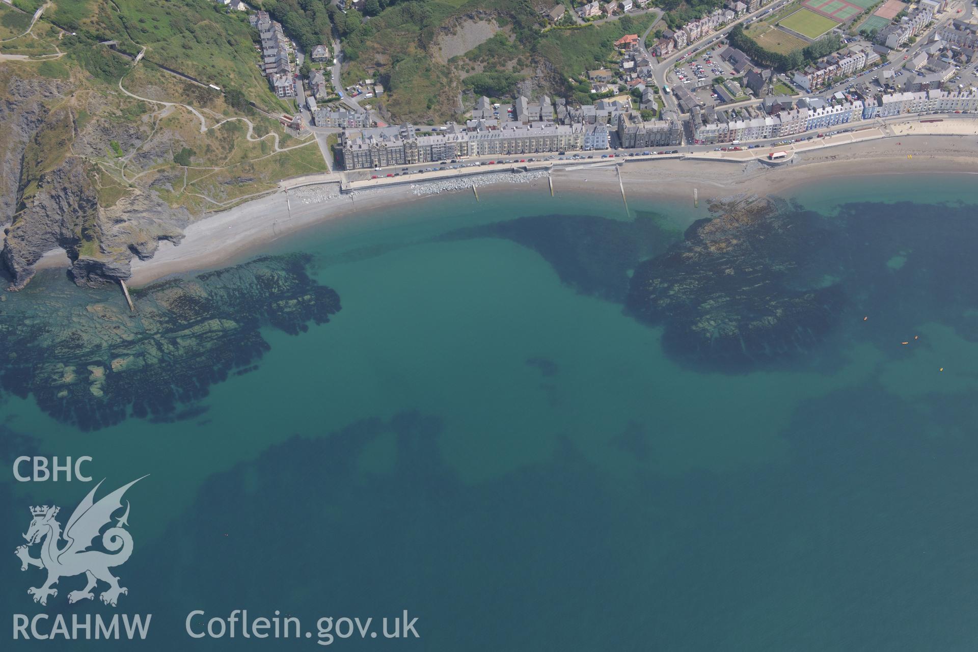 View of Aberystwyth including Promenade, Victoria Terrace, Alexandra Hall of Residence and the old County Hall. Oblique aerial photograph taken during Royal Commission?s programme of archaeological aerial reconnaissance by Toby Driver on 12th July 2013.