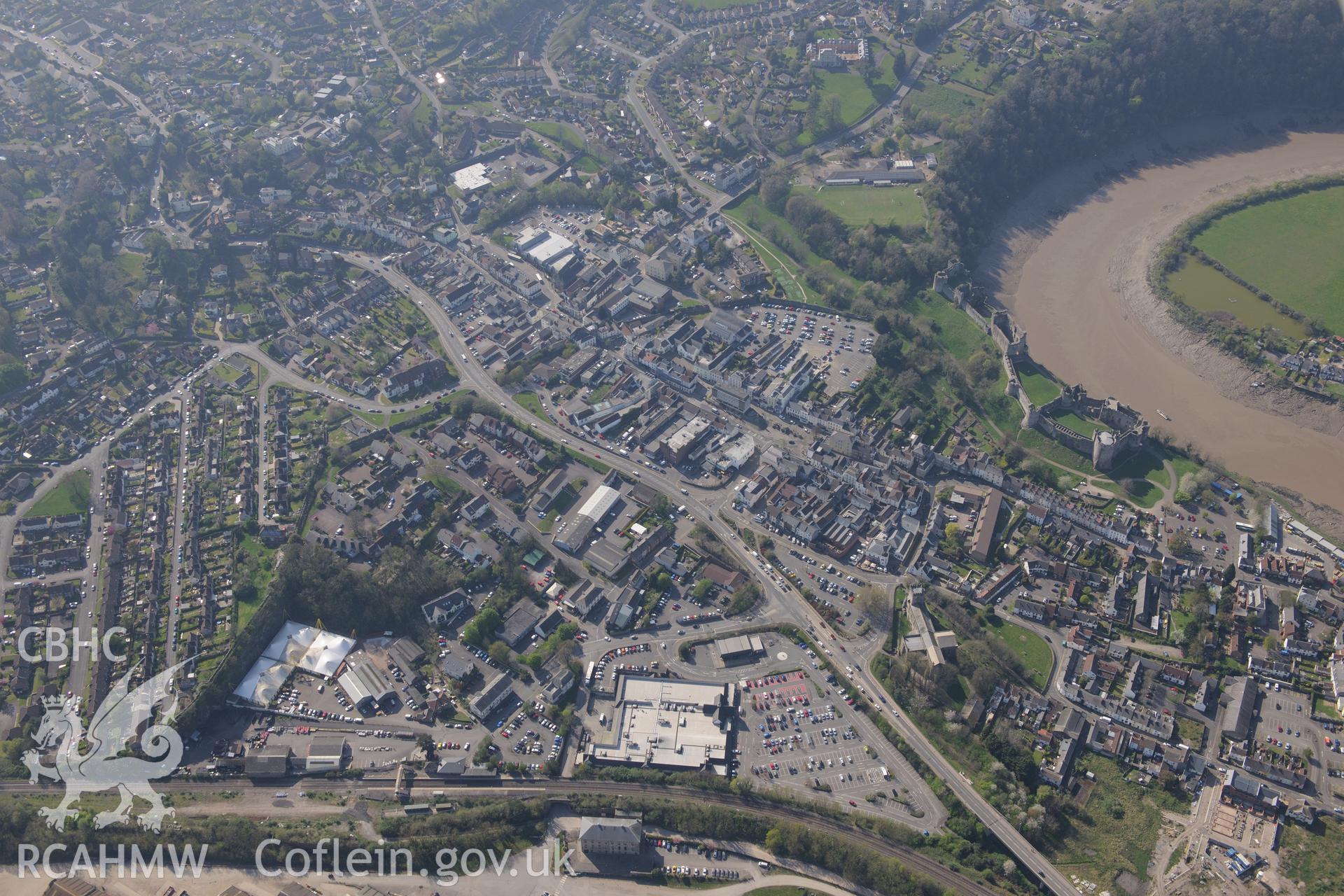 Chepstow including views of the Castle, St. Mary's Church, the Town Wall, Port Wall School, Sharpe's Steam Flour Mill and the Mount House. Oblique aerial photograph taken during the Royal Commission's programme of archaeological aerial reconnaissance by Toby Driver on 21st April 2015.