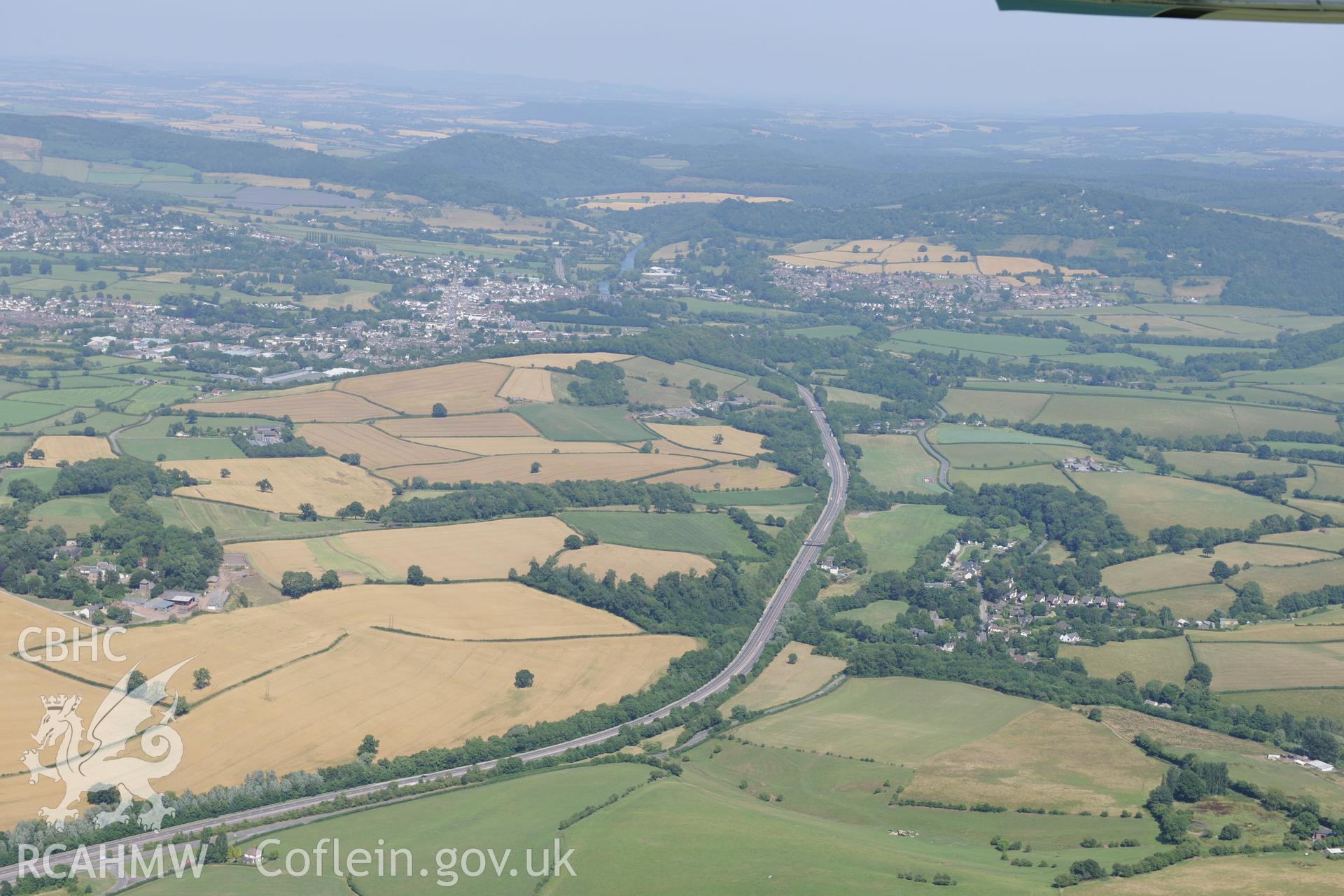 Monmouth, viewed from the west. Oblique aerial photograph taken during the Royal Commission?s programme of archaeological aerial reconnaissance by Toby Driver on 1st August 2013.