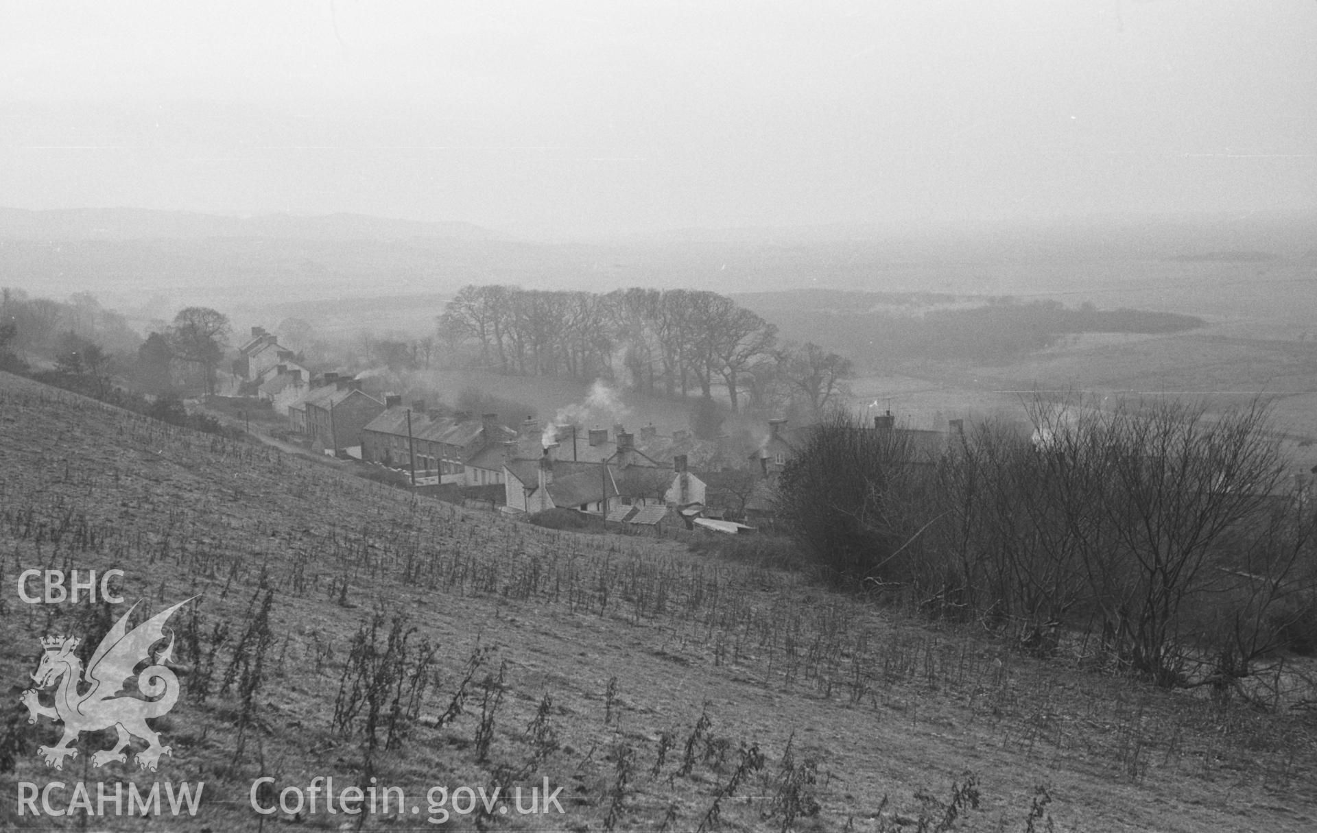 Digital copy of a black and white negative showing view of Taliesin from the field between the school and Coed Tafarn-Fach. Photographed in December 1963 by Arthur O. Chater.