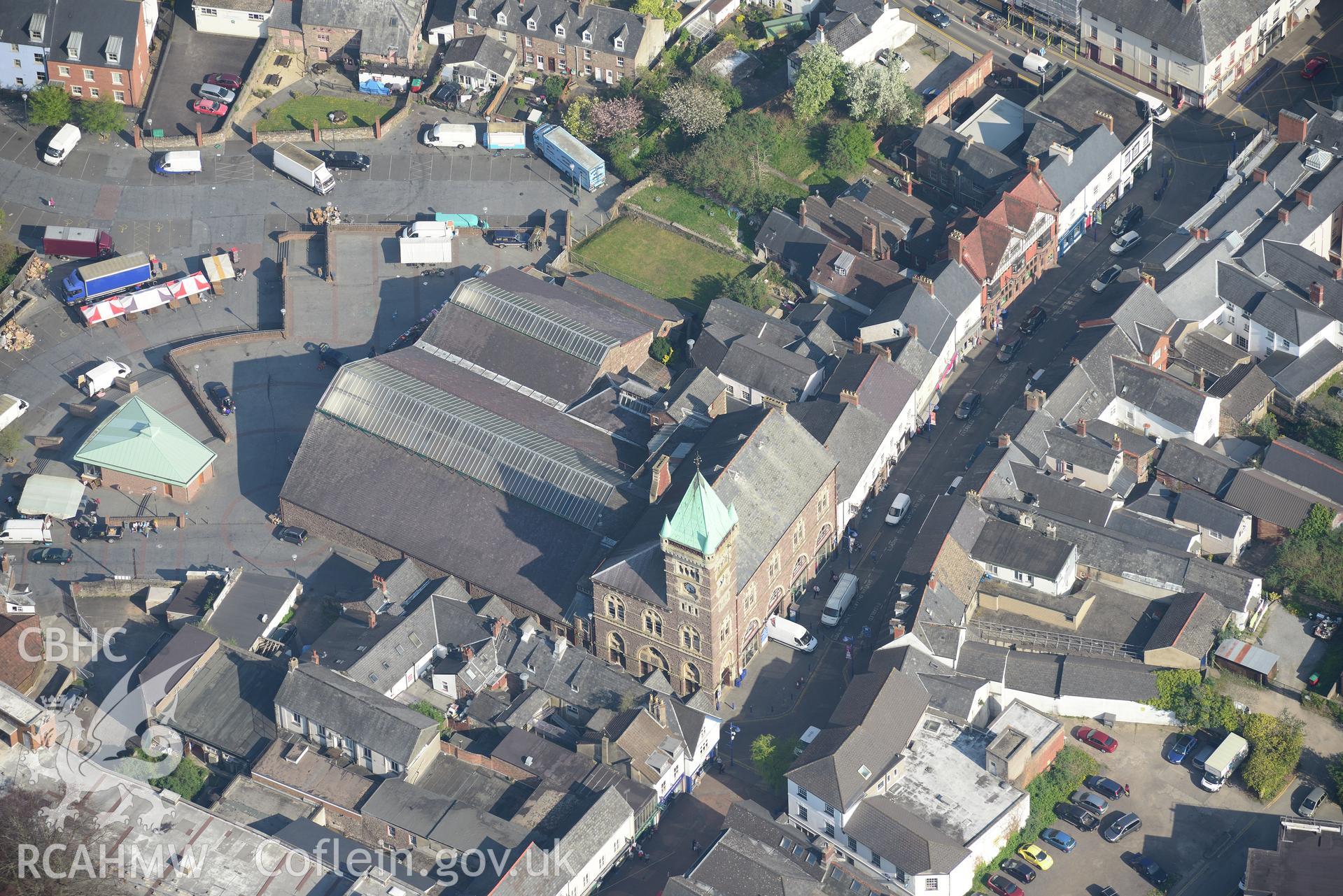 Abergavenny including the Town and Market Halls; the Kings Head Inn and the Brewery Yard. Oblique aerial photograph taken during the Royal Commission's programme of archaeological aerial reconnaissance by Toby Driver on 21st April 2015.