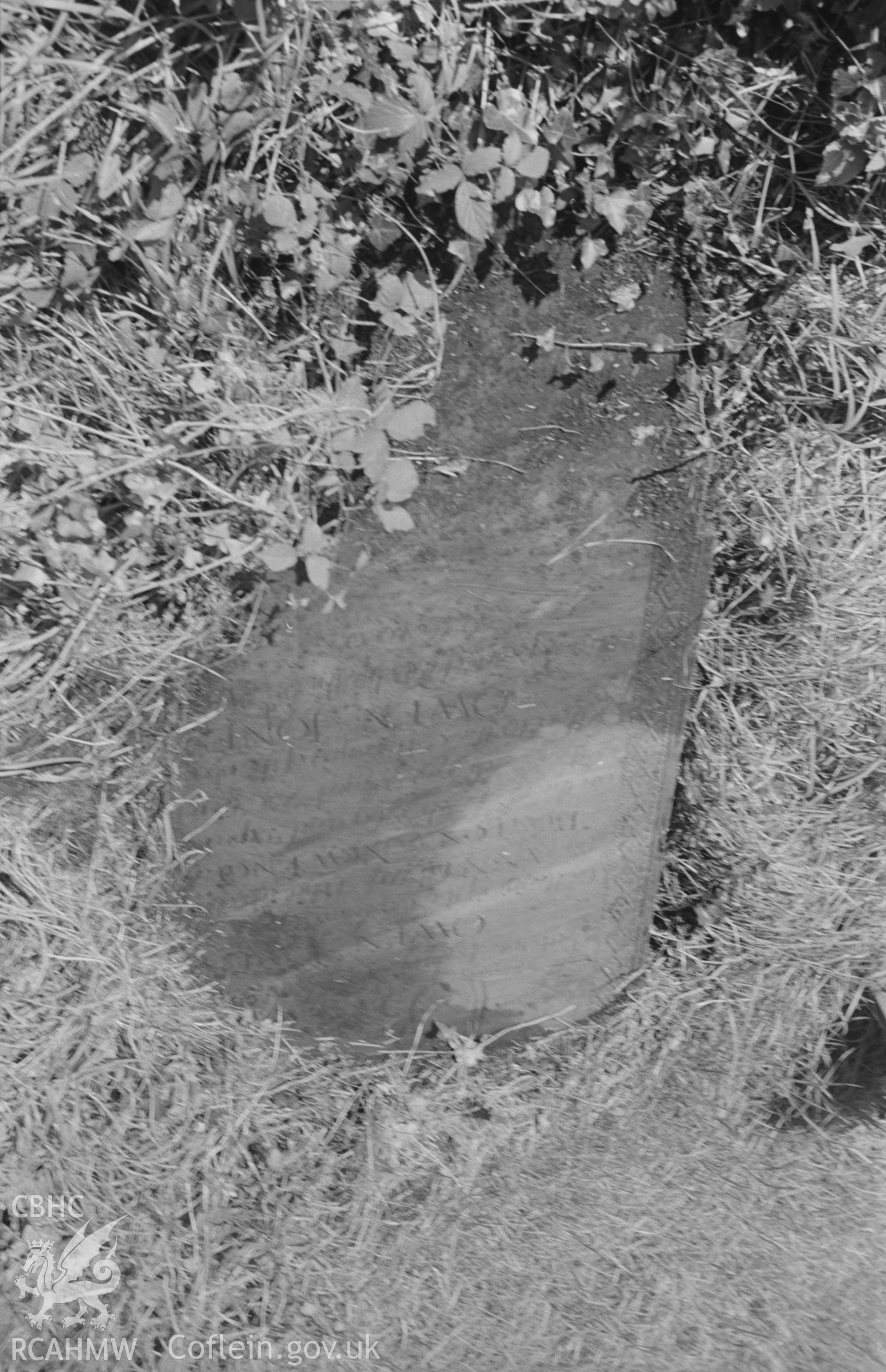 Digital copy of a black and white negative showing gravestone to Anne Jones, to the south east of the south transept of St. Padarn's churchyard, Llanbadarn, Aberystwyth. Photographed by Arthur O. Chater on 19th August 1967 from Grid Reference SN 599 809.