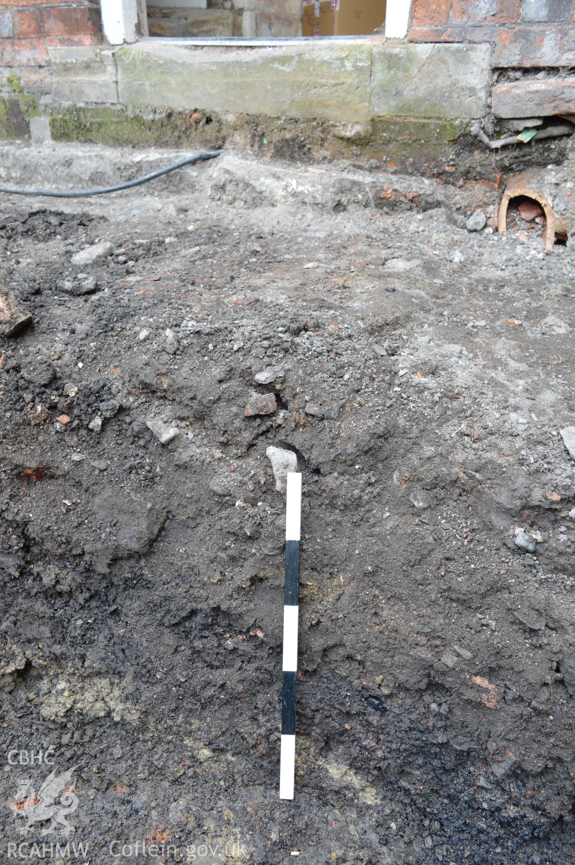 Digital colour photograph showing view from the north sshowing deposits within draining trench. Photographed as part of CPAT Project 2351: 2 Severn Street, Welshpool, Powys - Archaeological Watching Brief, 2019. Report no. 1663.