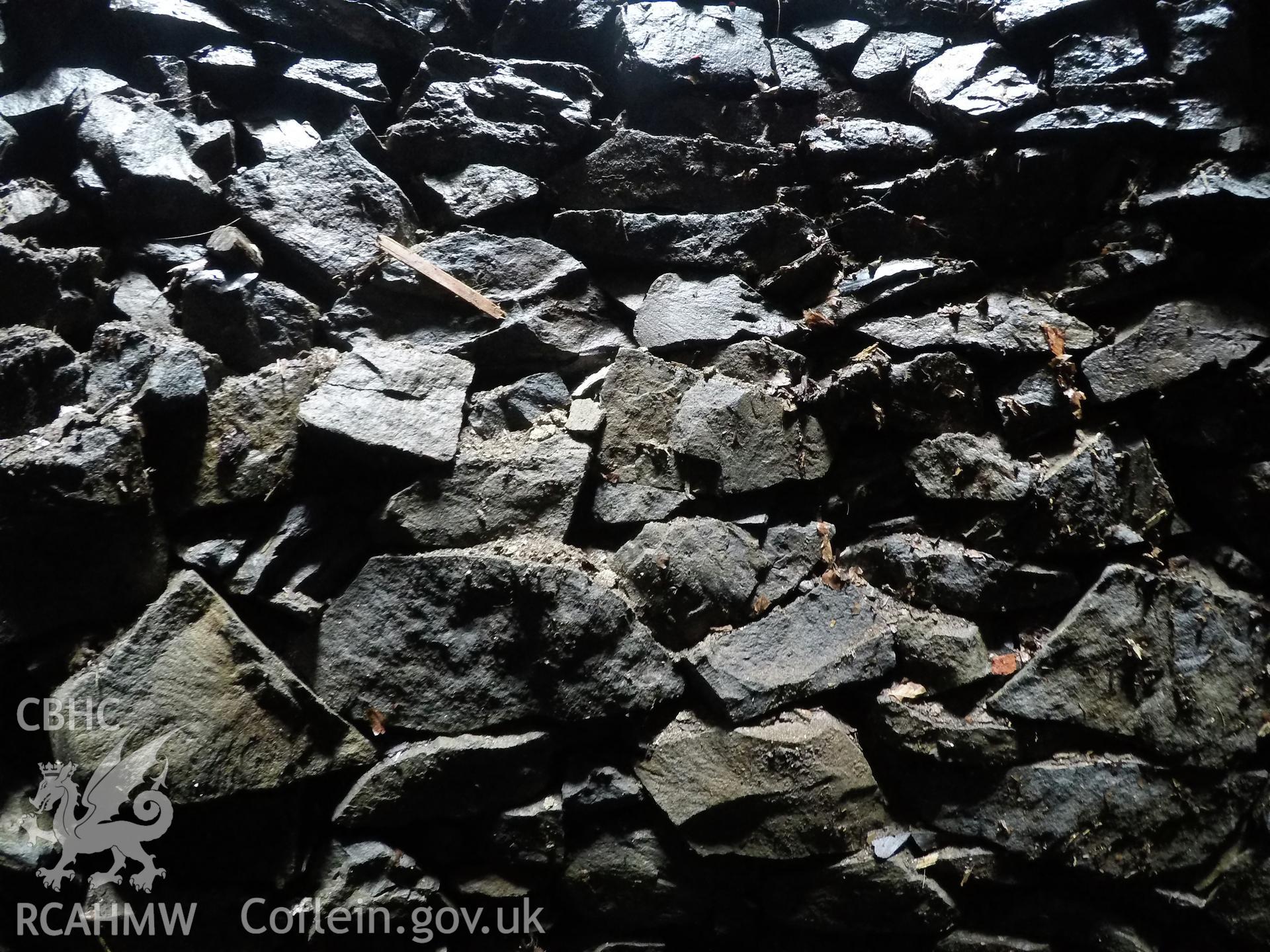 View from the west of well interior at 4.8m depth. Photographed by Gwynedd Archaeological Trust as part of archaeological mitigation report for well at Plas Celynin, Henryd, Conwy, on 1st August 2018. Project no. G2568.