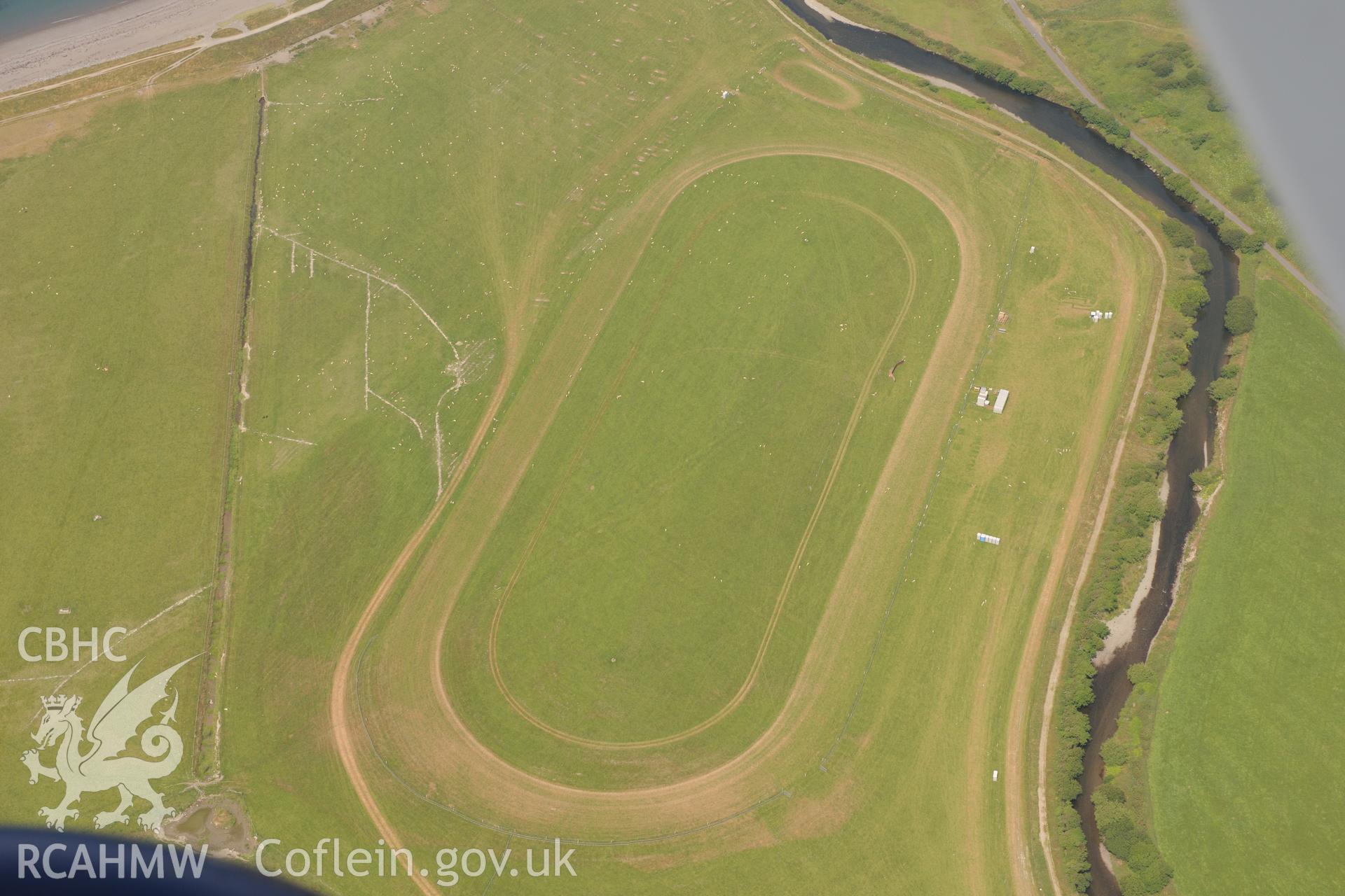 Ceredigion Trotting Circuit at Tan y Castell, Aberystwyth. Oblique aerial photograph taken during the Royal Commission?s programme of archaeological aerial reconnaissance by Toby Driver on 12th July 2013.