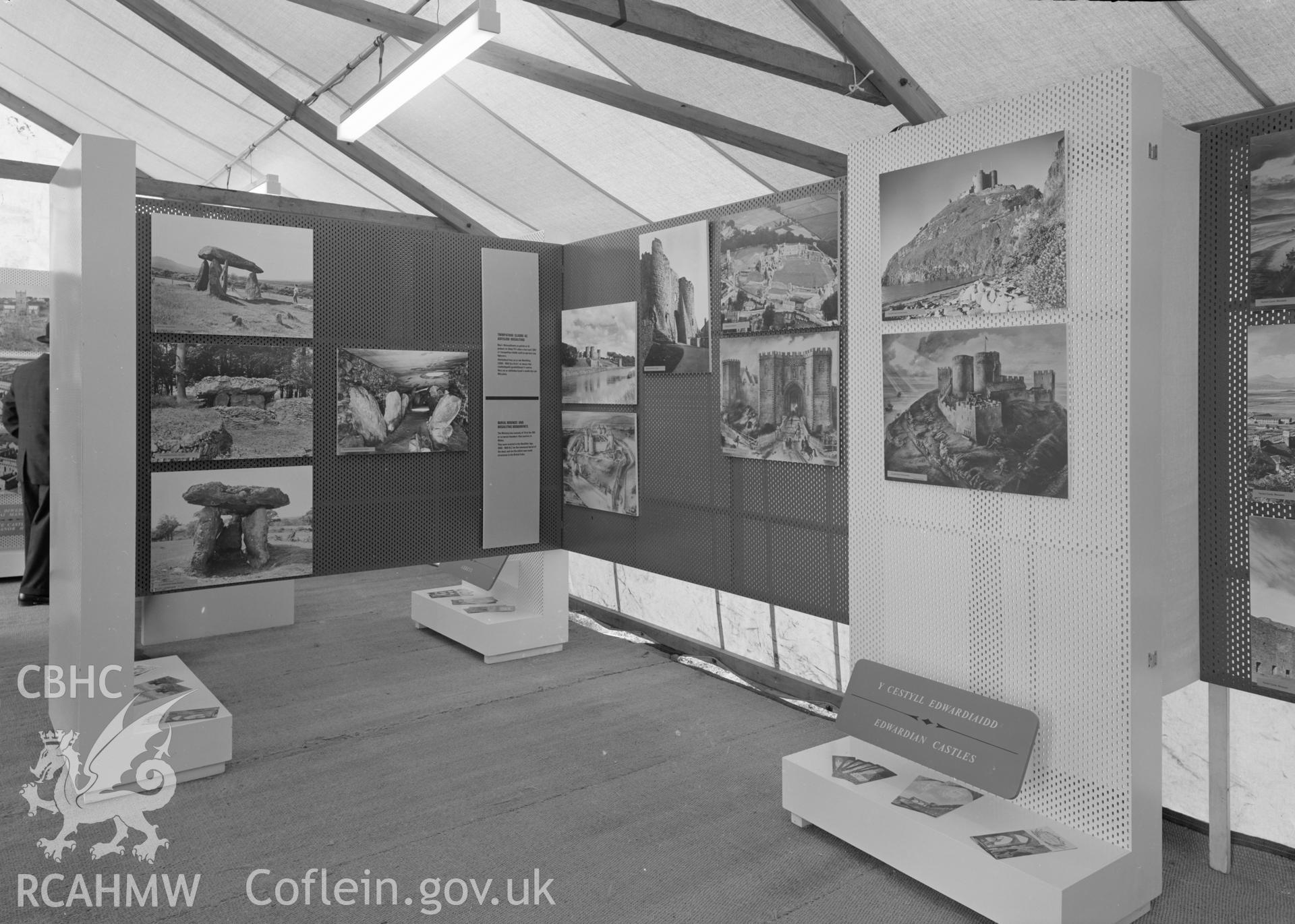 Digital copy of a nitrate negative showing Ministry of Public Building and Works. Exhibition of Ancient Monuments in Wales at The National Eisteddfod, Bala, 1967. "Displays of Burial Chambers and Edwardian Castles (1)".