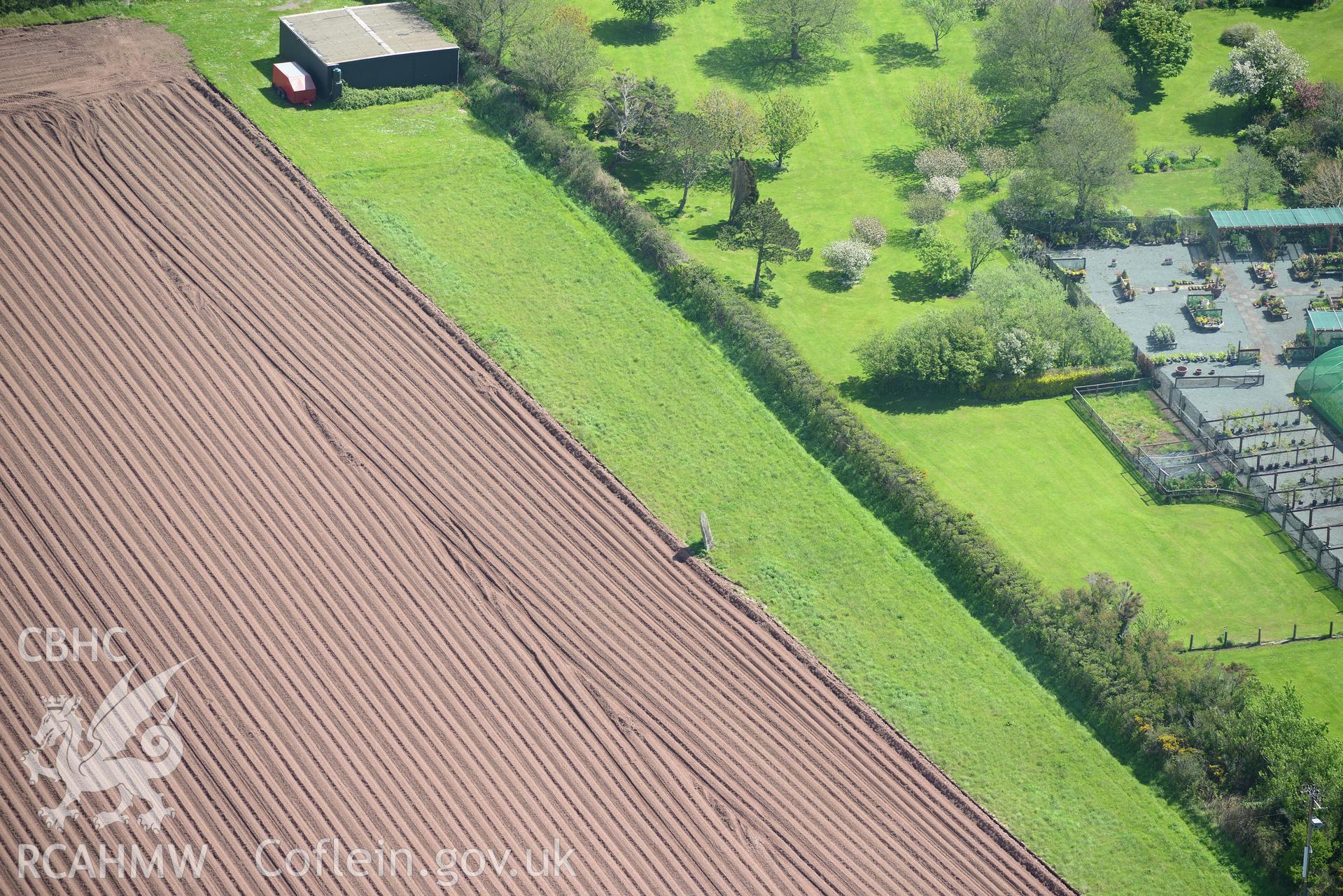 Longstone standing stone near Mabesgate, St. Ishmaels. Oblique aerial photograph taken during the Royal Commission's programme of archaeological aerial reconnaissance by Toby Driver on 15th May 2015.