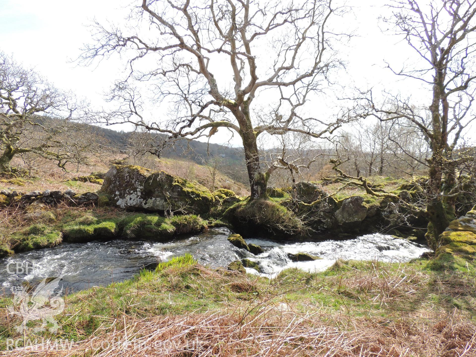 'Turbine House location. Looking east south-east.' Photographed as part of desk based assessment and heritage impact assessment of a hydro scheme on the Afon Croesor, Brondanw Estate, Gwynedd. Produced by Archaeology Wales for Renewables First Ltd. 2018.