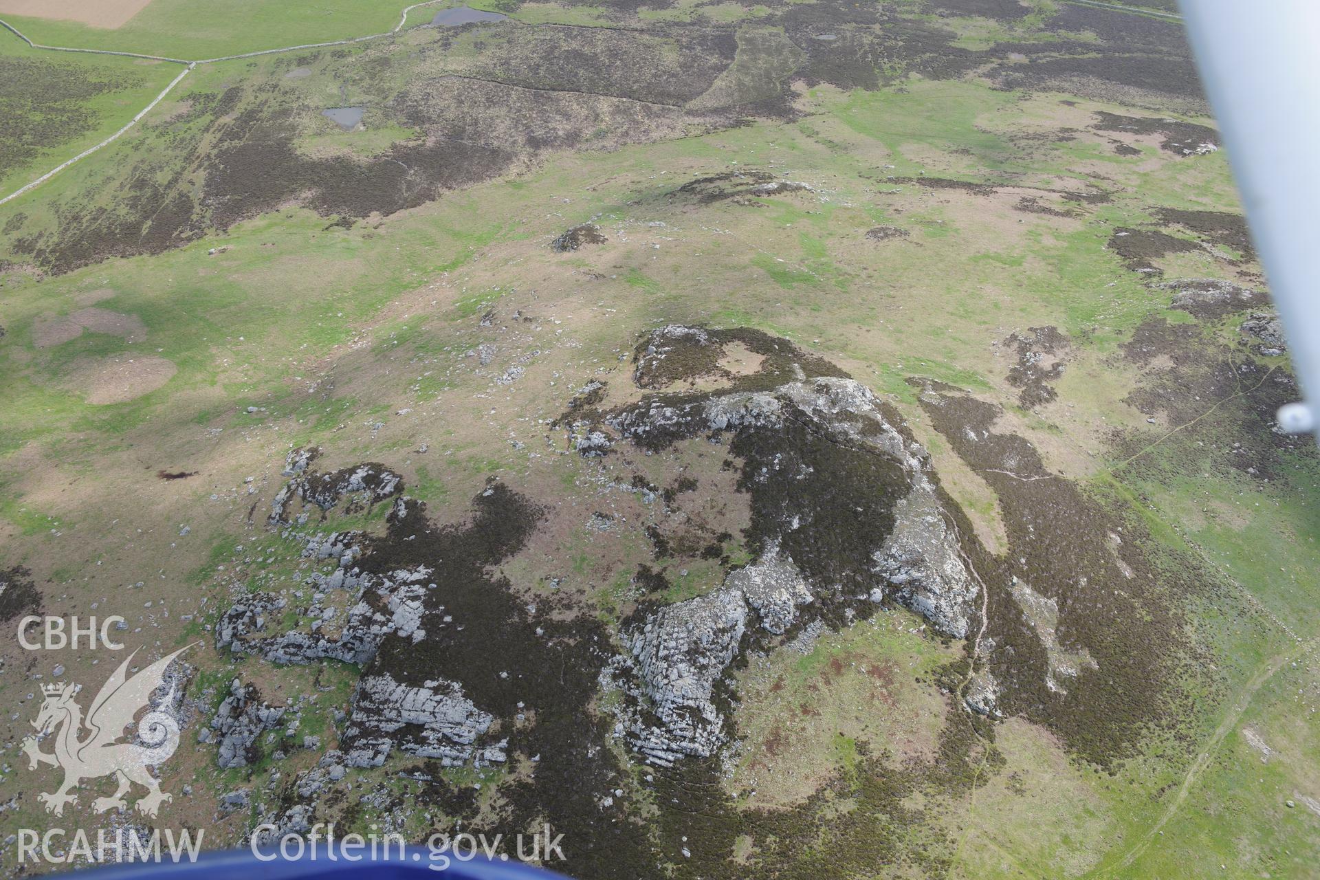 Carn Llundain and its relict field walls on Ramsey Island. Oblique aerial photograph taken during the Royal Commission's programme of archaeological aerial reconnaissance by Toby Driver on 13th May 2015.