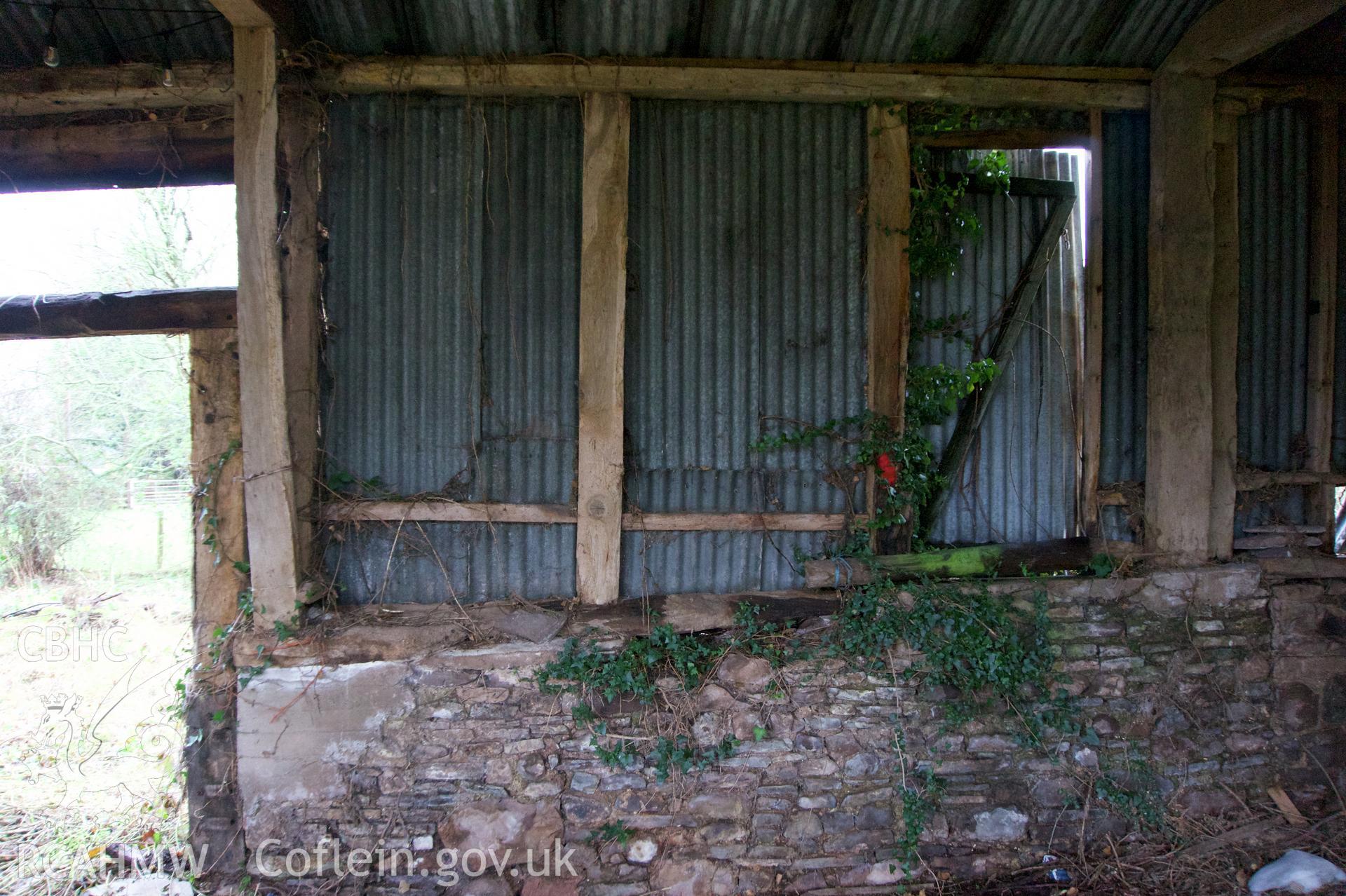 Inside of south wall, central bay, at Middle Ton Threshing Barn. Photographed for Historic Building Photographic Record of Middle Ton Threshing Barn, Llanvapley, by Dan Courtney of Cog Architects, 2019.