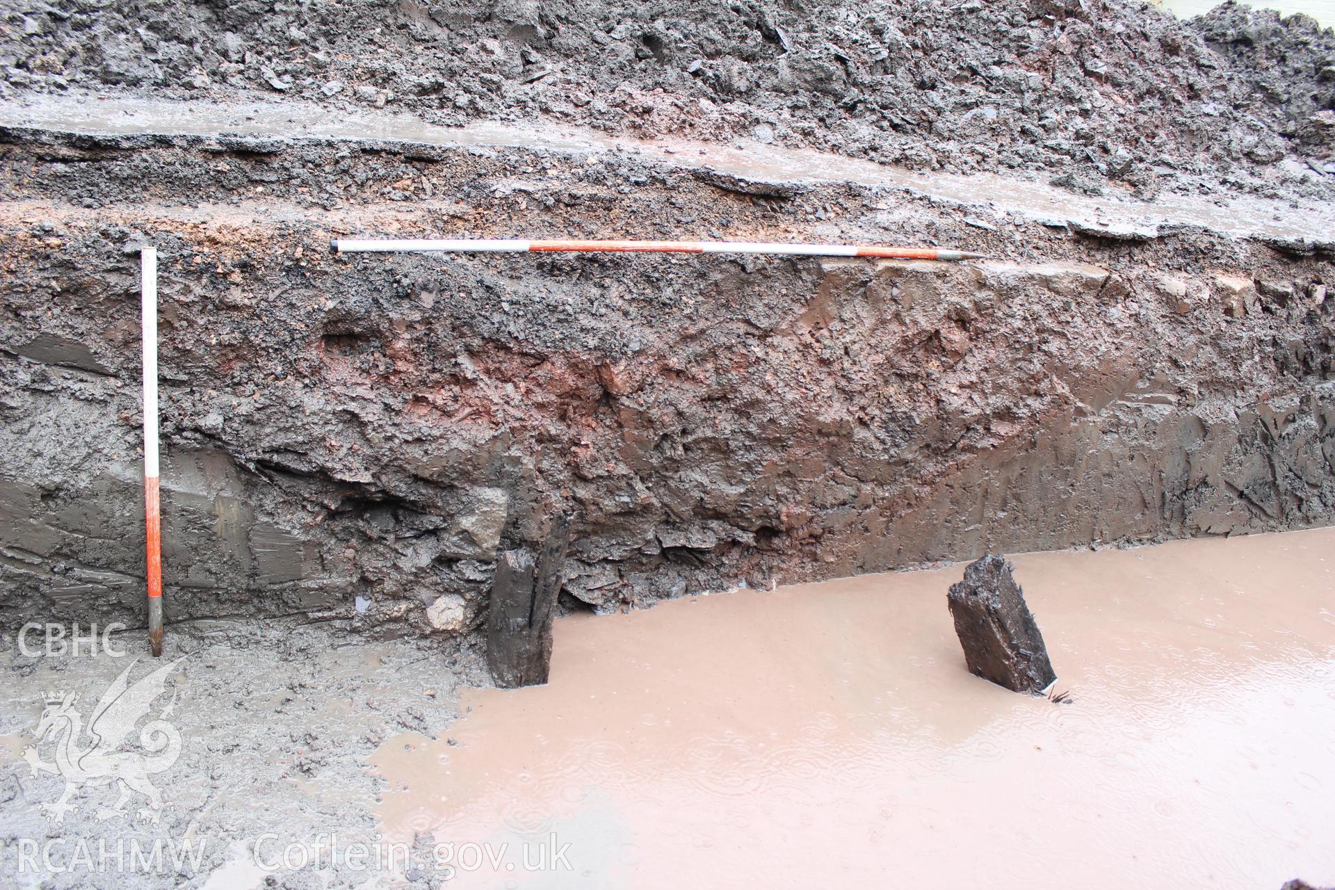 Detail shot of south facing section through Ditch Feature. Photographed as part of an Archaeological Evaluation of The Bridge Inn, Chepstow, carried out by Archaeology Wales, 2015.