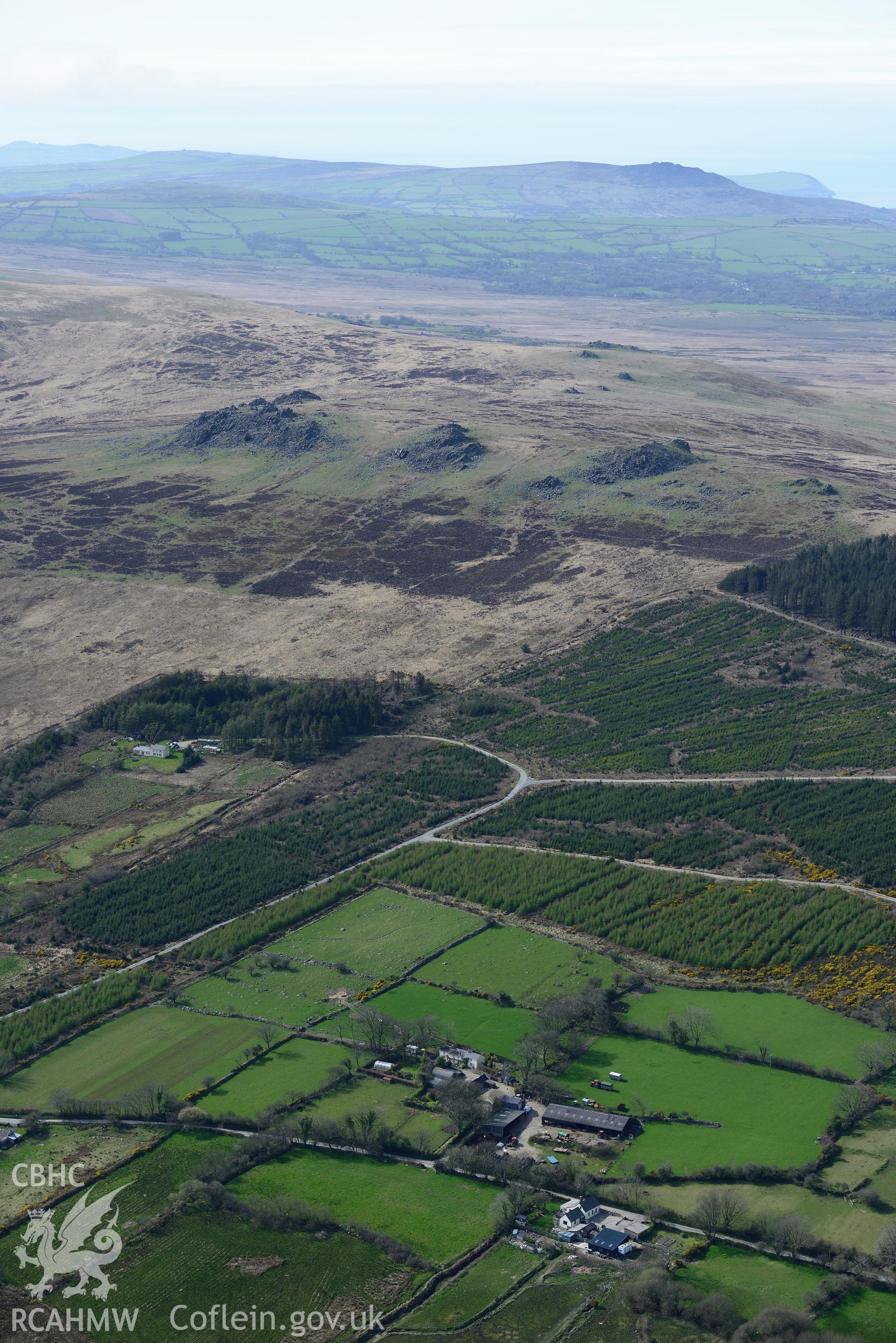 Carn Meini; Carn Menyn and Carn Menyn 'bluestone' outcrops. Oblique aerial photograph taken during the Royal Commission's programme of archaeological aerial reconnaissance by Toby Driver on 15th April 2015.