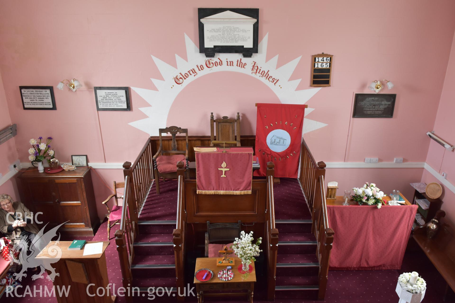 Colour photograph showing interior view looking towards pulpit at the Baptist & Unitarian Chapel, Nottage, Porthcawl, taken during photographic survey conducted by Sue Fielding on 12th May 2018.