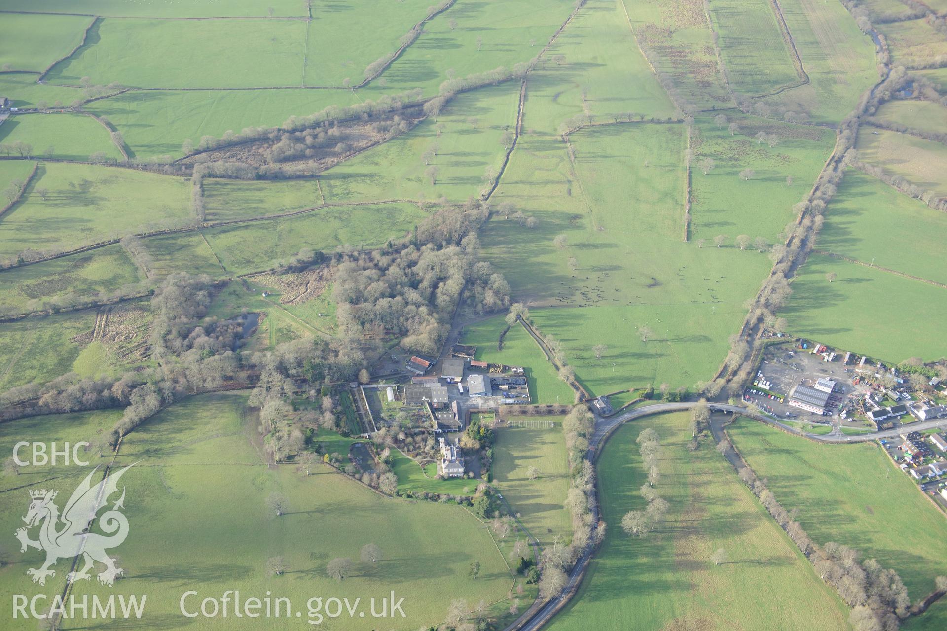Talsarn village, and Llanllyr manison and gardens. Oblique aerial photograph taken during the Royal Commission's programme of archaeological aerial reconnaissance by Toby Driver on 6th January 2015.