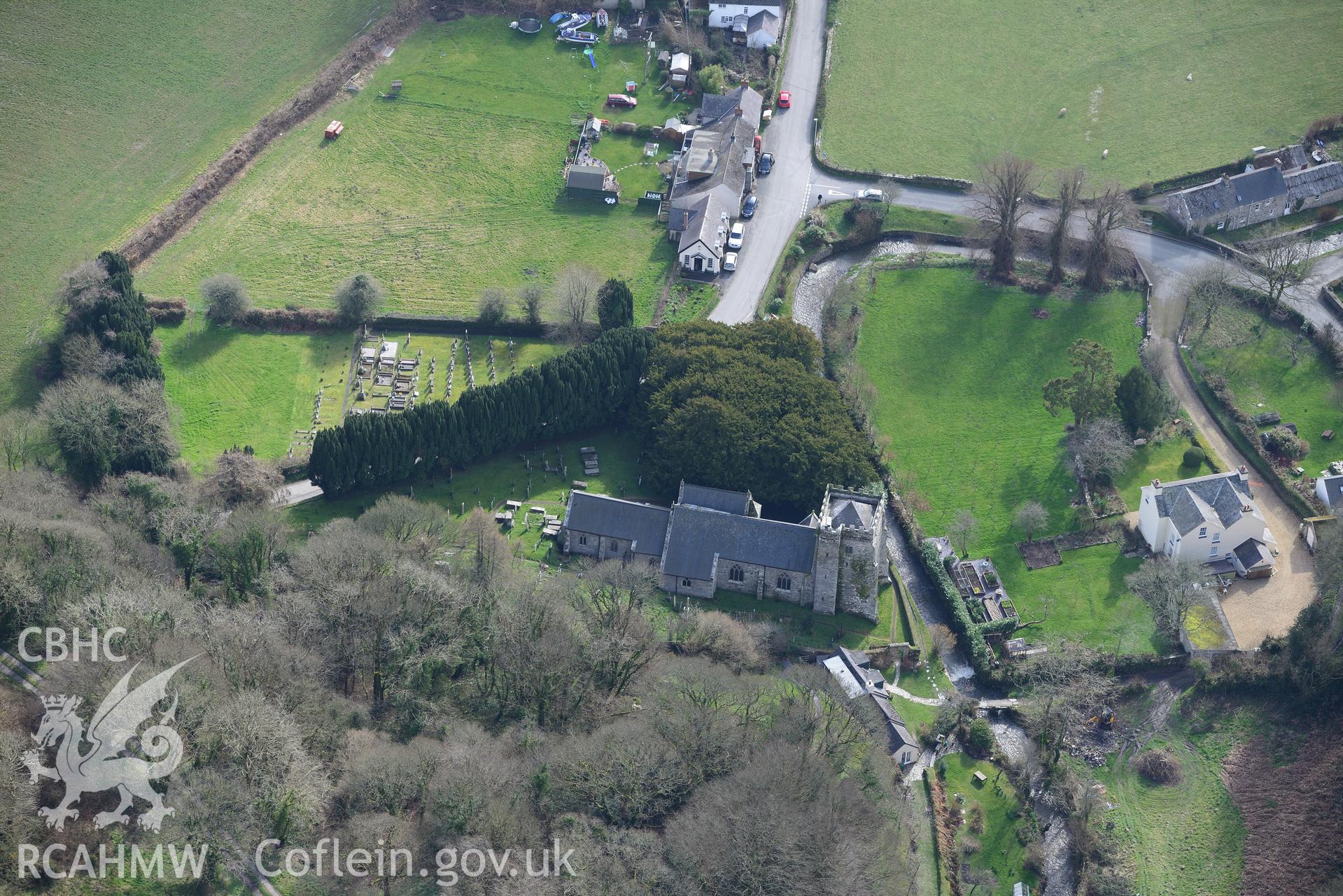 St. Brynach's church and churchyard in the village of Nevern. Oblique aerial photograph taken during the Royal Commission's programme of archaeological aerial reconnaissance by Toby Driver on 13th March 2015.