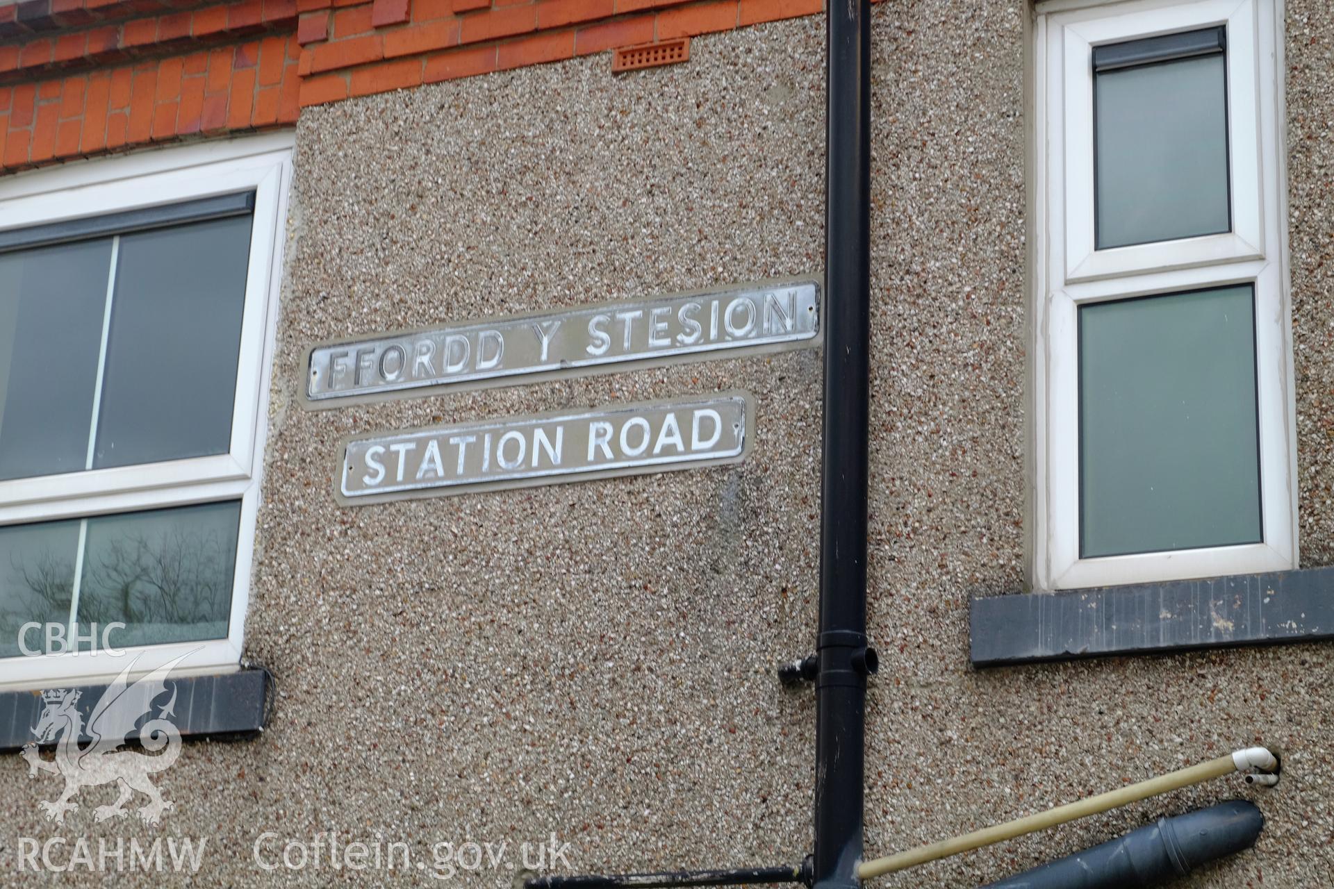Colour photograph showing view looking at English-Welsh street signs on Station Road, Bethesda, produced by Richard Hayman 2nd February 2017