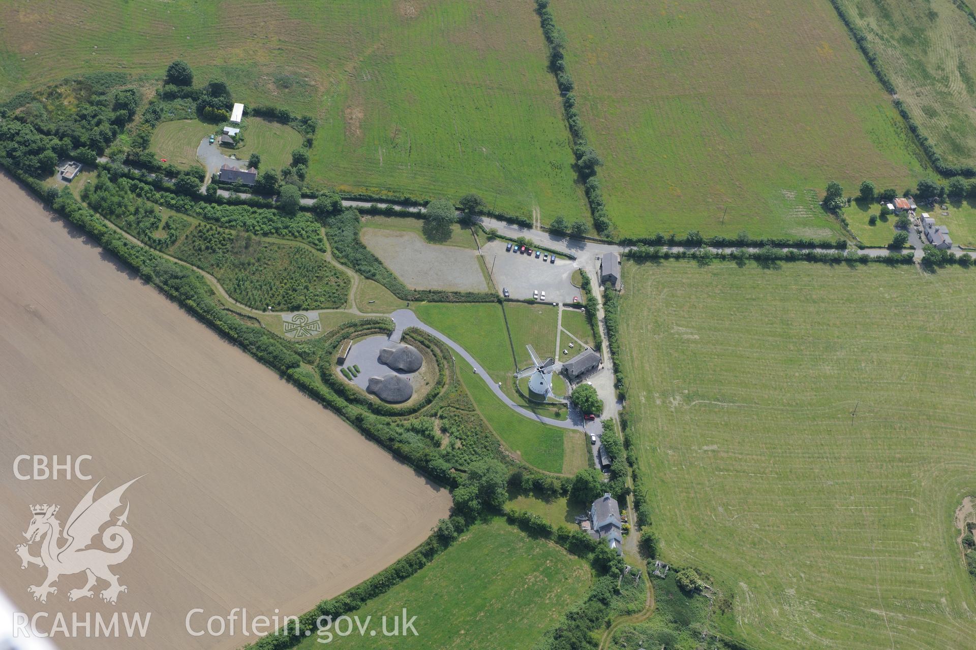 Roundhouses at Melin Llynon, Llanddeusant. Oblique aerial photograph taken during the Royal Commission?s programme of archaeological aerial reconnaissance by Toby Driver on 12th July 2013.