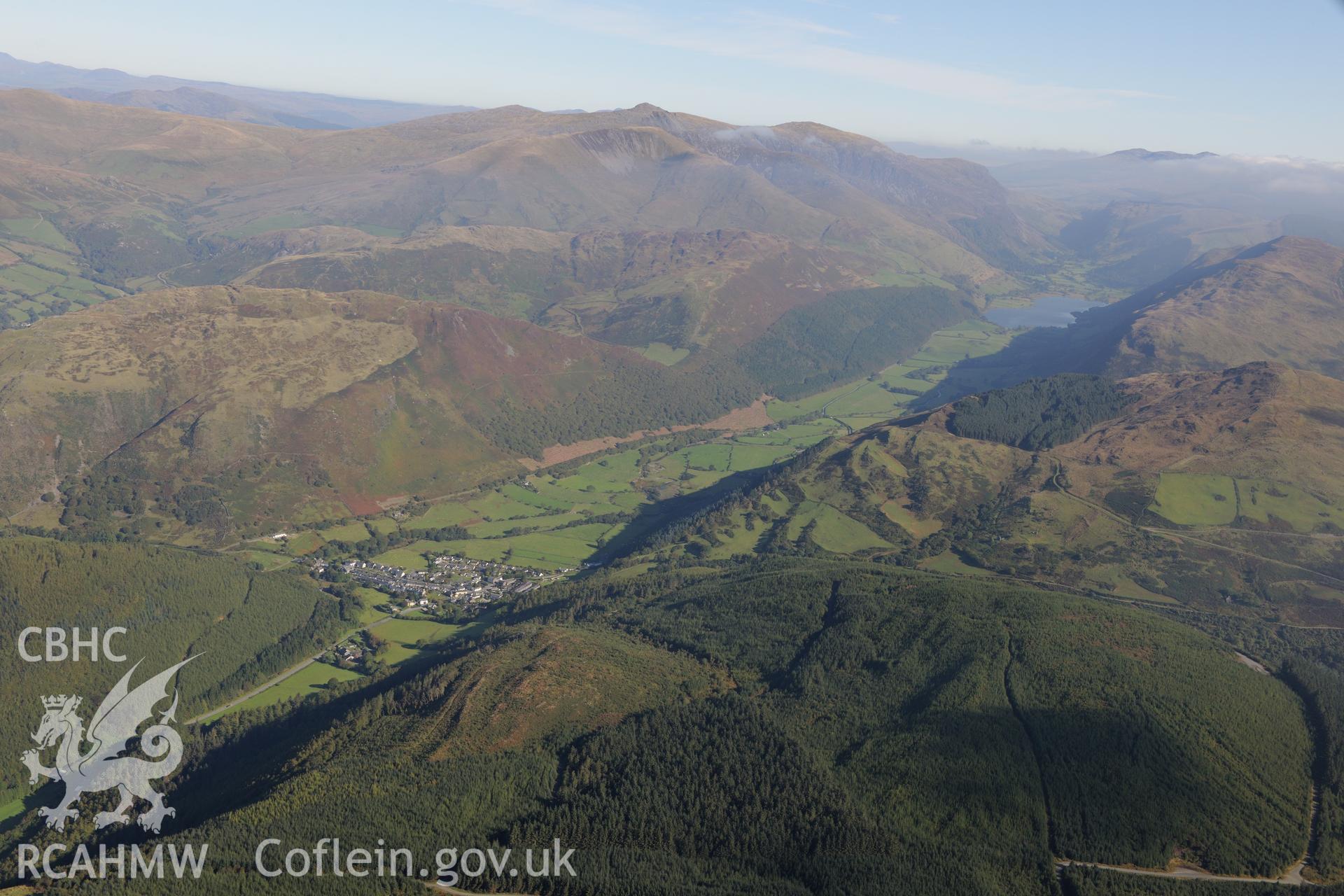 Abergynolwyn with Tal-y-Llyn lake beyond. Oblique aerial photograph taken during the Royal Commission's programme of archaeological aerial reconnaissance by Toby Driver on 2nd October 2015.