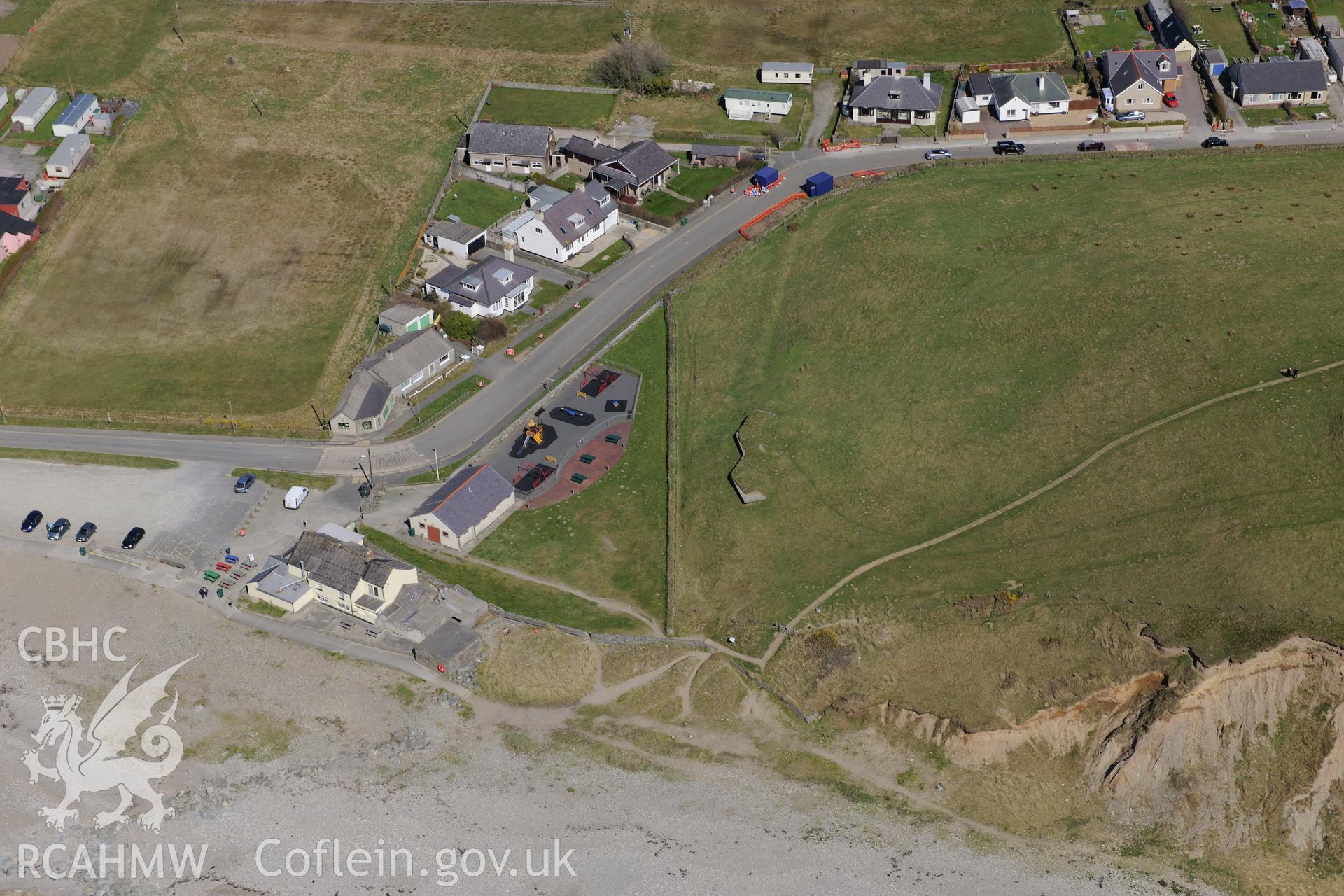 Dinas Dinlle Hillfort and Seagull Trench, Llandwrog. Oblique aerial photograph taken during the Royal Commission?s programme of archaeological aerial reconnaissance by Toby Driver on 1st May 2013.