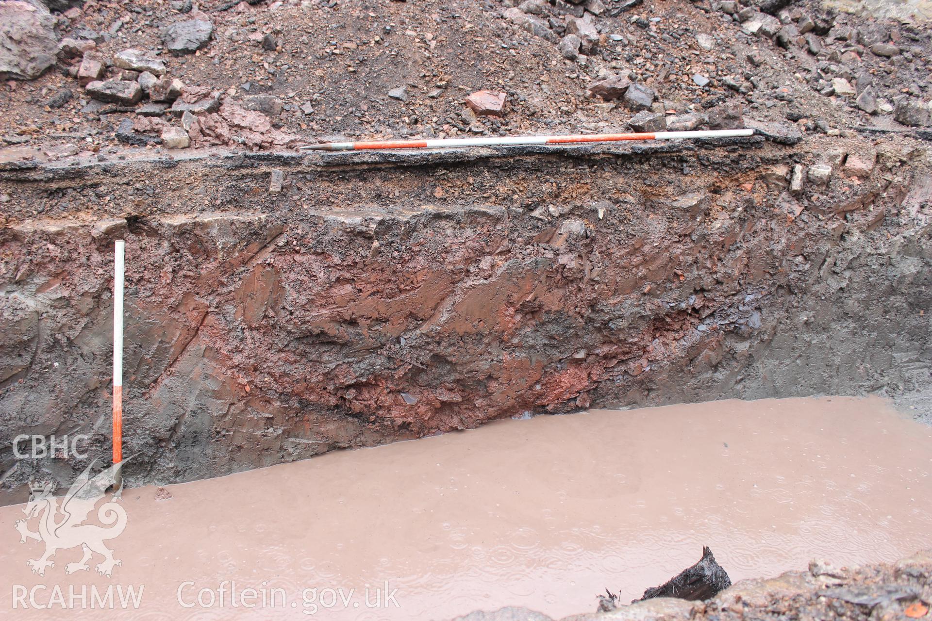 Detail shot of trench section. Photographed as part of an Archaeological Evaluation of The Bridge Inn, Chepstow, carried out by Archaeology Wales, 2015.