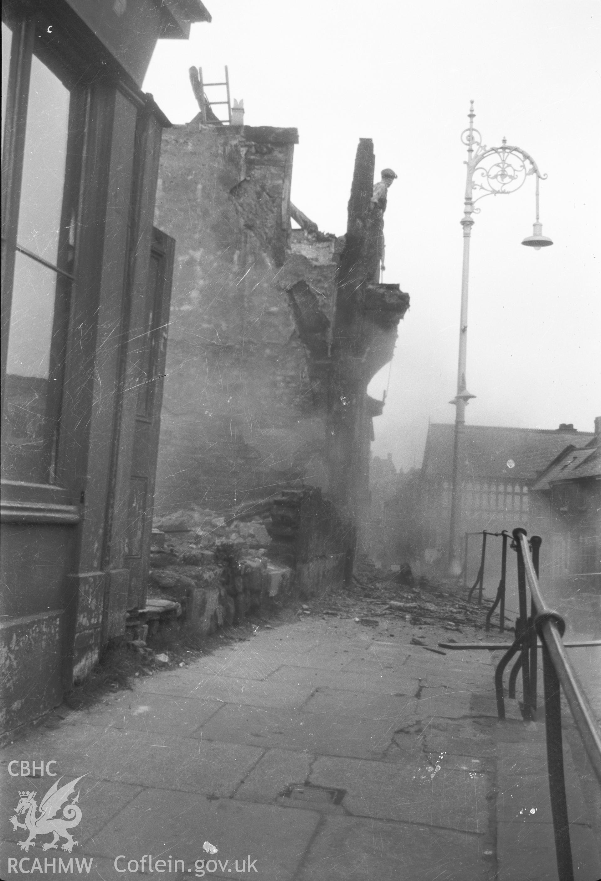 Digital copy of a nitrate negative showing an unidentified building in Wrexham - demolition in progress, taken by RCAHMW
