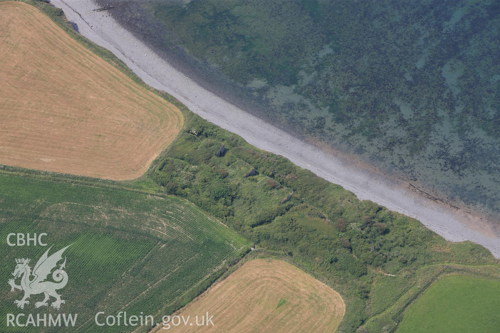 Craiglas limekilns and Llanon breakwater. Oblique aerial photograph taken during the Royal Commission?s programme of archaeological aerial reconnaissance by Toby Driver on 12th July 2013.
