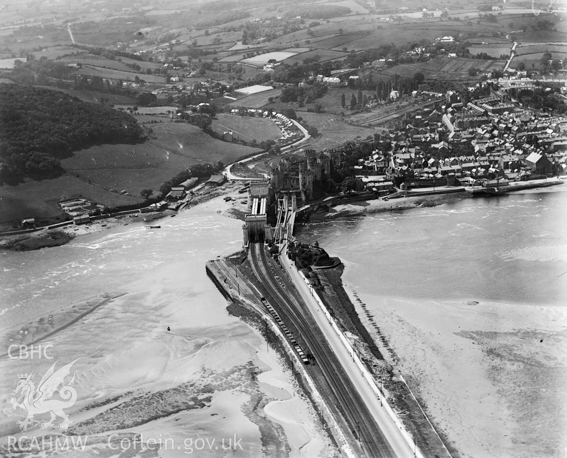 View of Conwy showing railway and causeway, oblique aerial view. 5?x4? black and white glass plate negative.