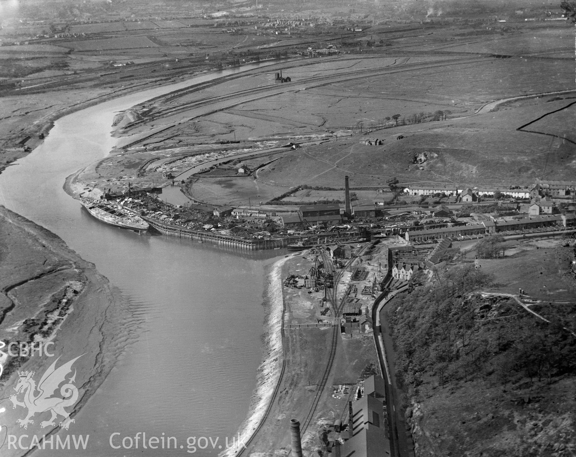 Black and white oblique aerial photograph showing the docks at Briton Ferry, from Aerofilms album Glamorgan A-B (W18), taken by Aerofilms Ltd and dated 1921.