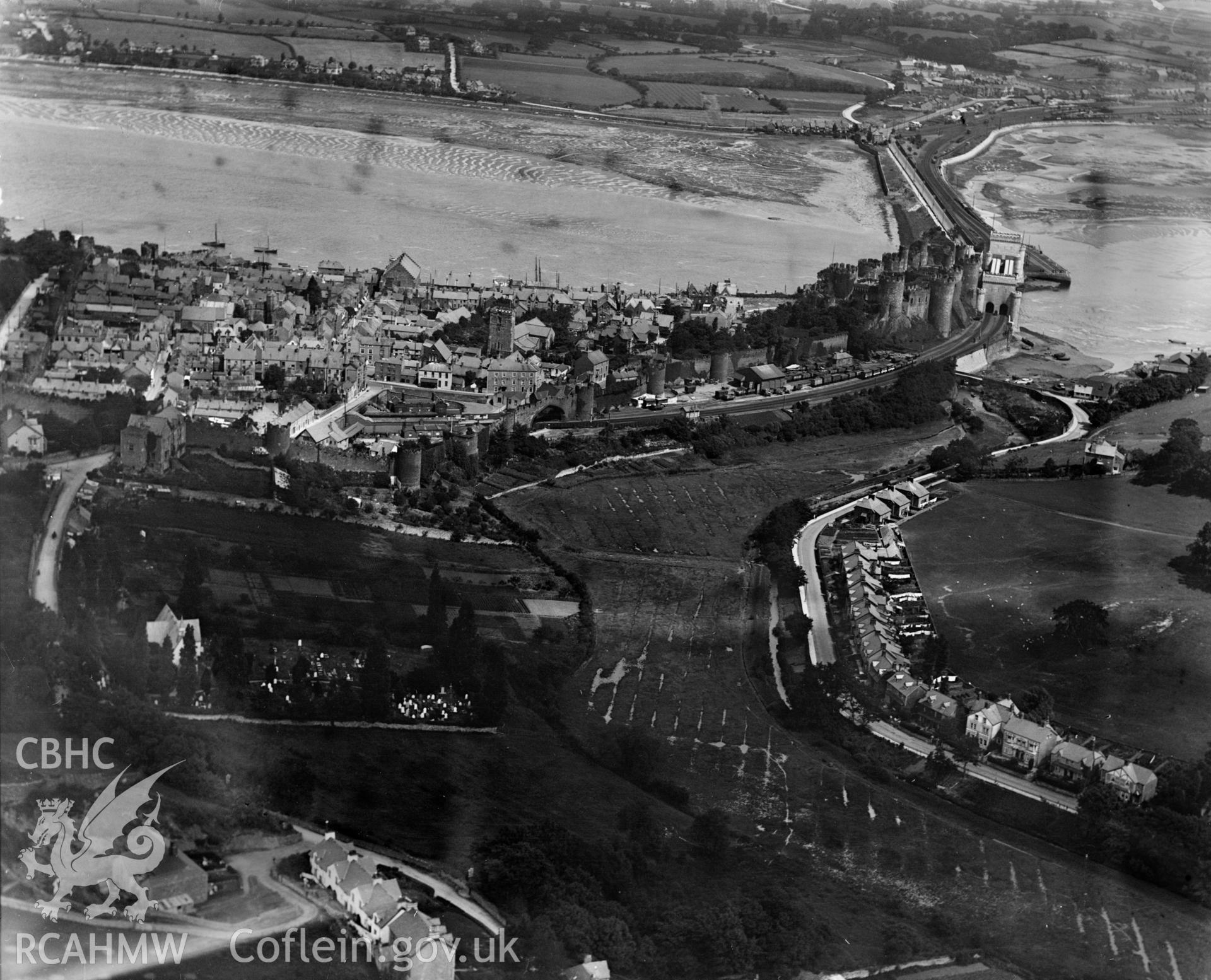View of Conwy Castle showing railway bridge, oblique aerial view. 5?x4? black and white glass plate negative.