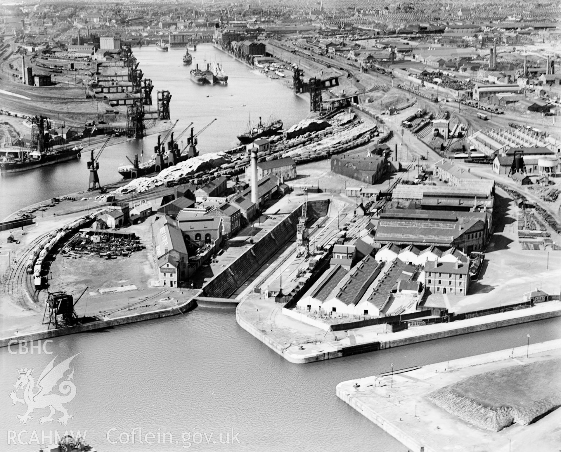 View of C.H. Bailey Ltd., dry dock owners & ship repairers and surrounding dockyard, Cardiff, oblique aerial view. 5?x4? black and white glass plate negative.
