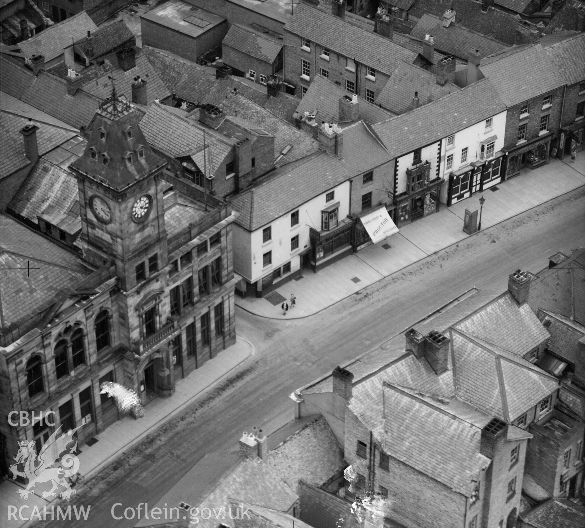 Black and white oblique aerial photograph showing Welshpool's Town Hall and Market in 1947, from Aerofilms album Merionethshire and Montgomeryshire, taken by Aerofilms Ltd and dated 1947.