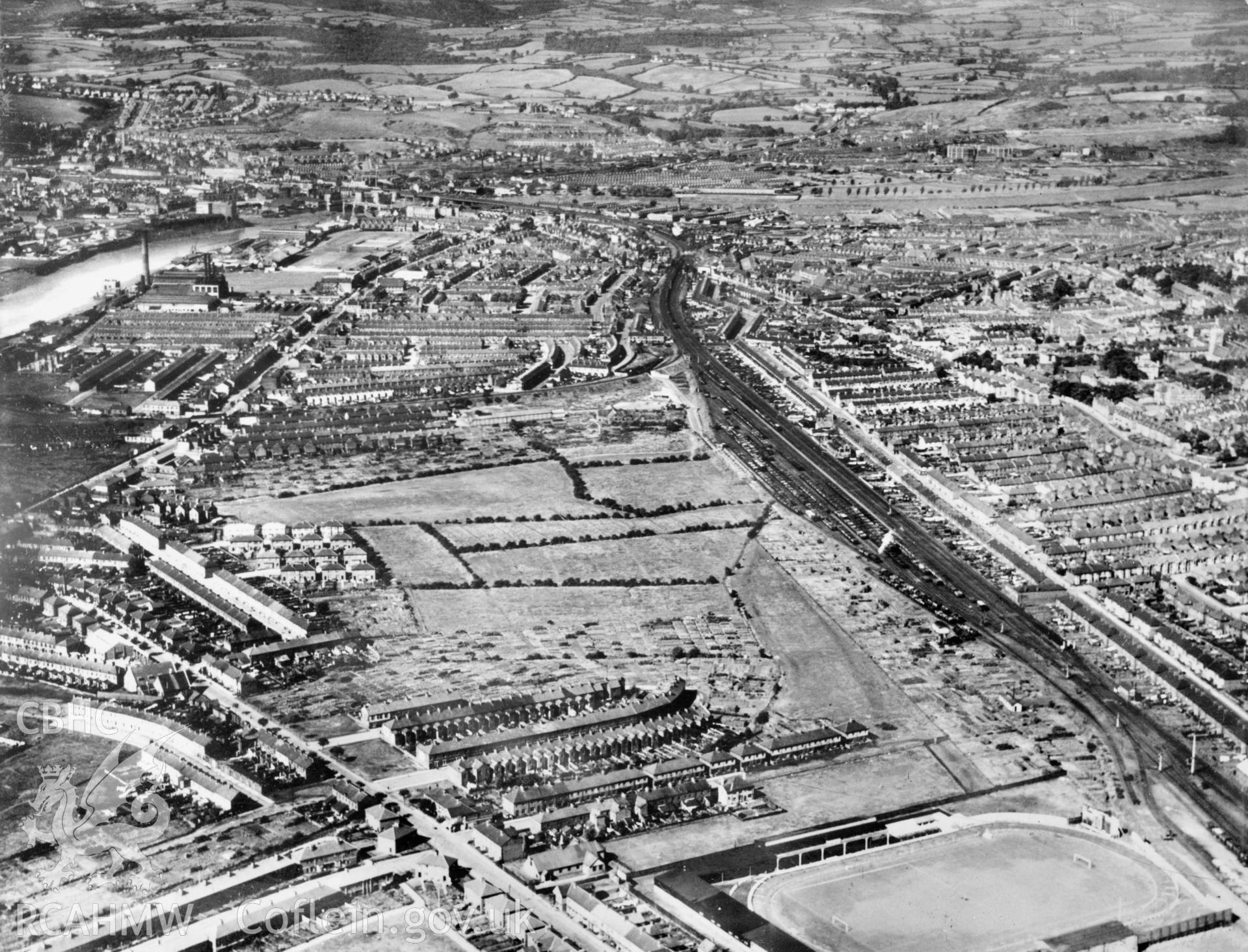 View of Newport showing Somerton Park football stadium. Oblique aerial photograph, 5?x4? BW glass plate.