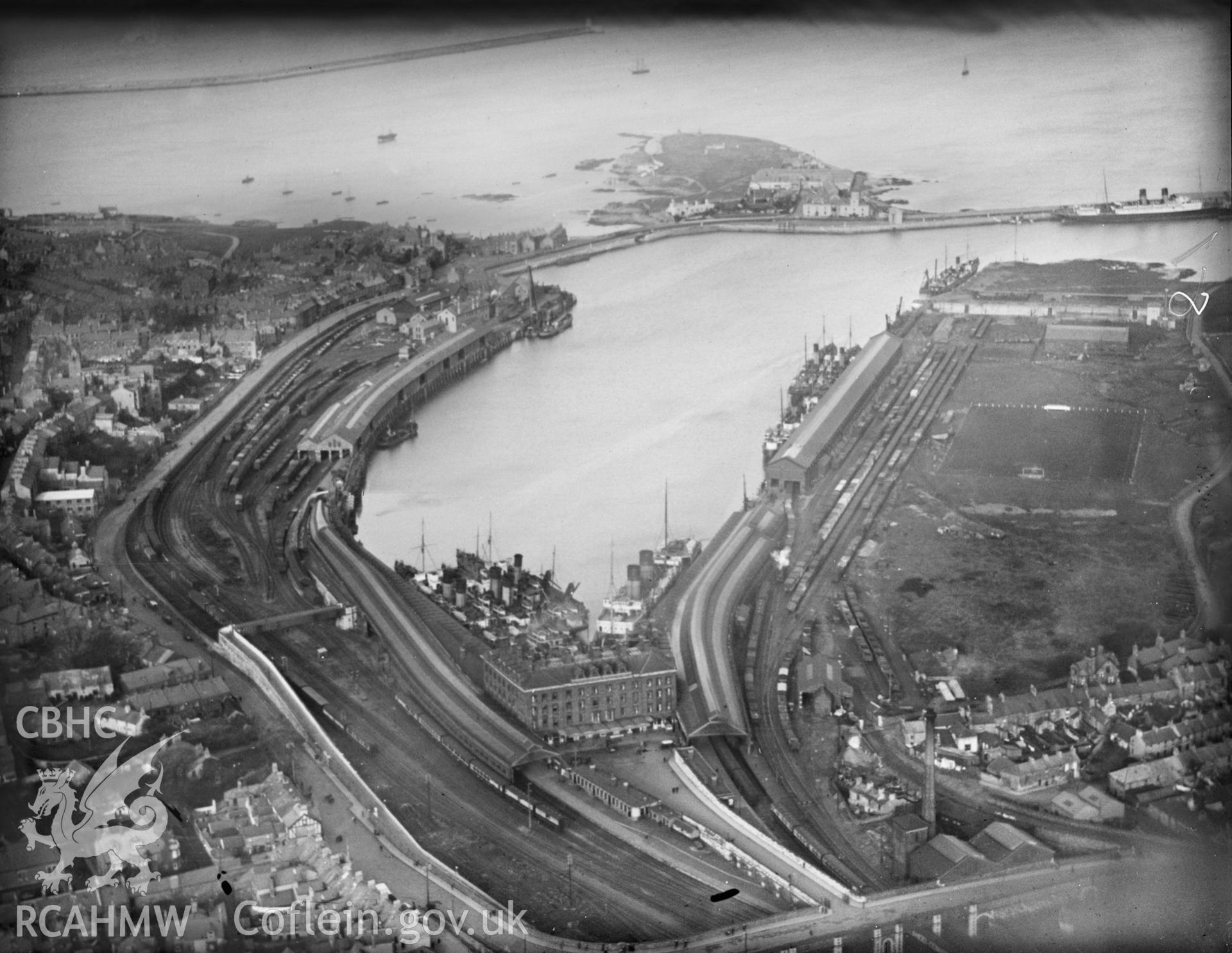 View of Holyhead showing football ground and docks, oblique aerial view. 5?x4? black and white glass plate negative.