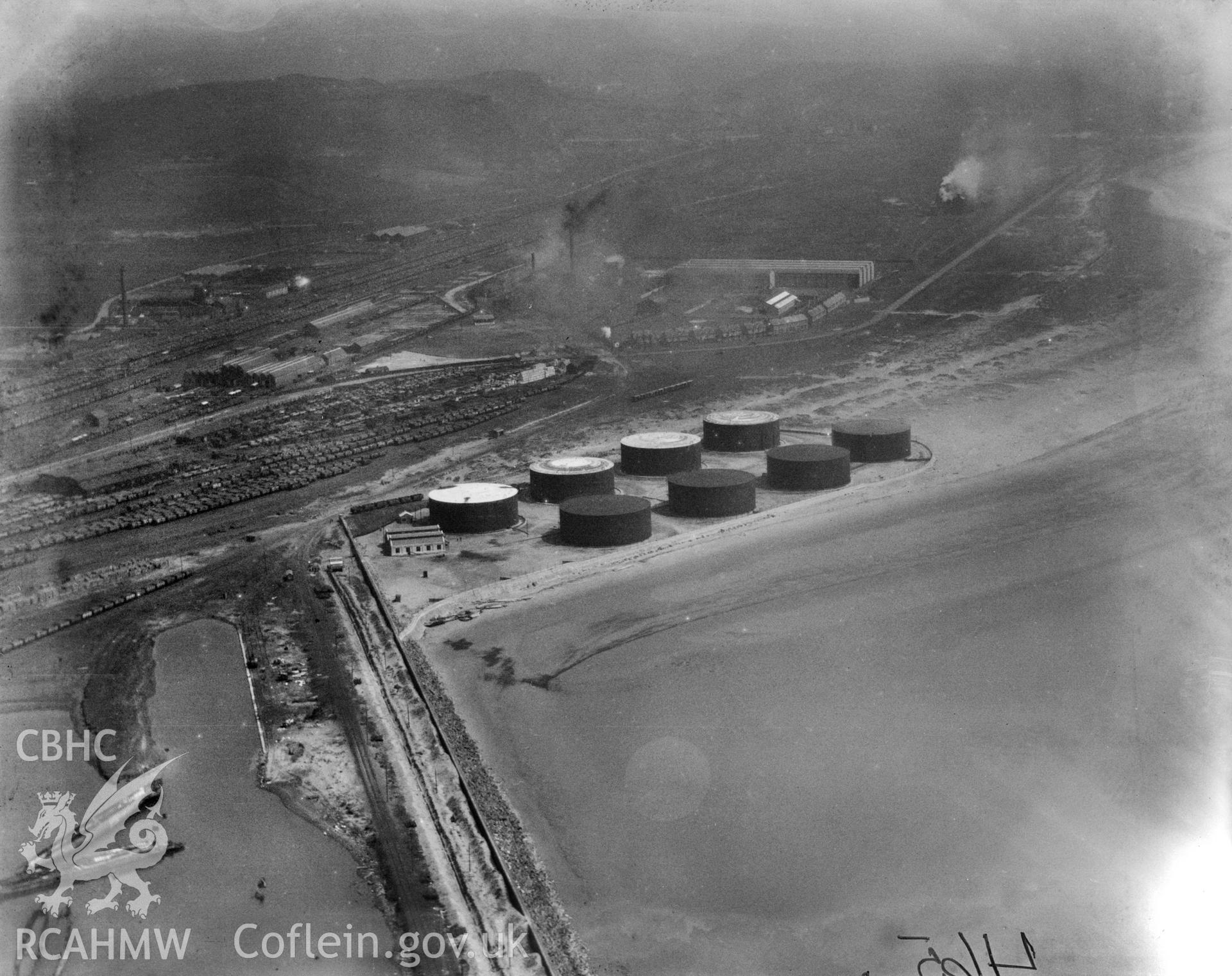 View of oil storage drums at Crumlin Burrows, Swansea. Oblique aerial photograph, 5?x4? BW glass plate.
