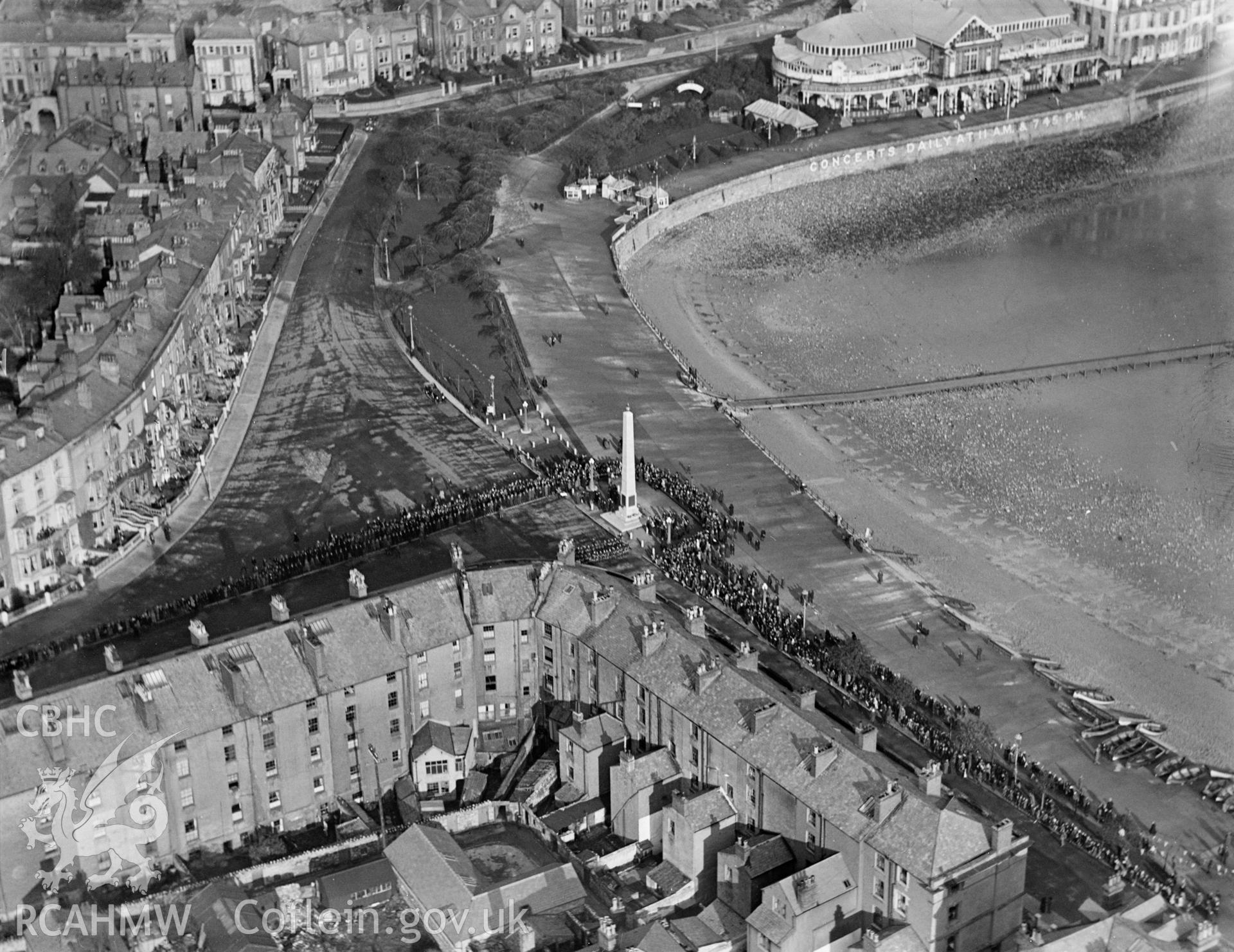 Llandudno, showing the Cenotaph war memorial during ceremony, oblique aerial view. 5?x4? black and white glass plate negative.