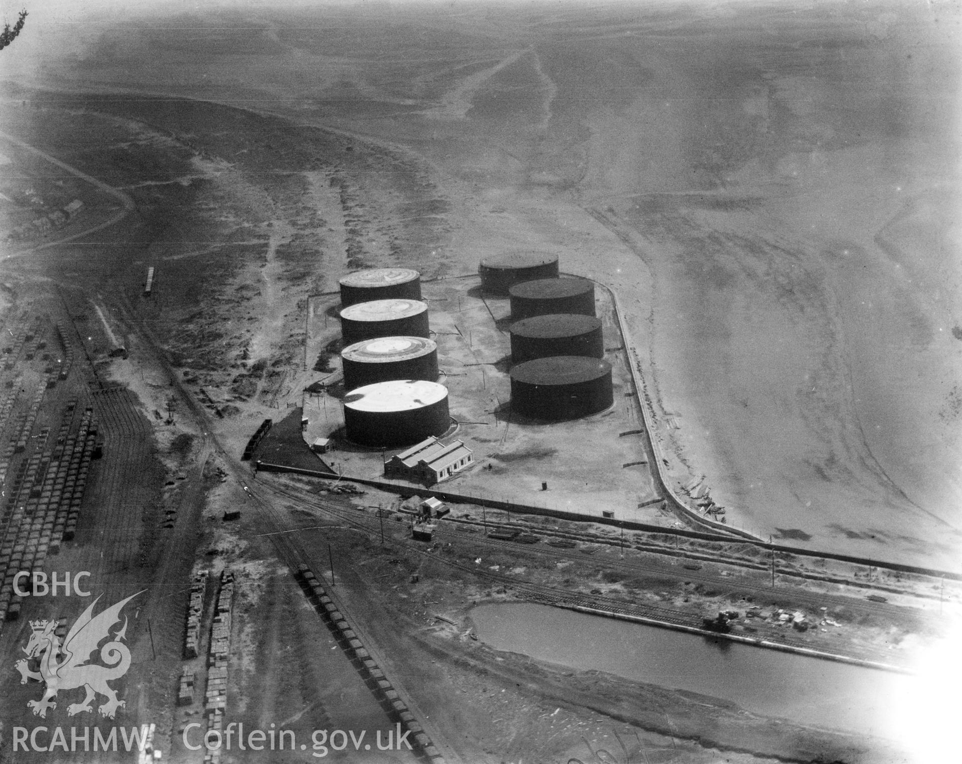 View of oil storage drums at Crumlin Burrows, Swansea. Oblique aerial photograph, 5?x4? BW glass plate.