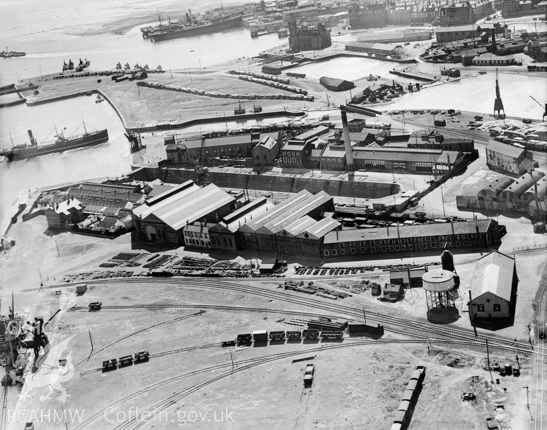 View of C.H. Bailey Ltd., dry dock owners & ship repairers and surrounding dockyard, Cardiff, oblique aerial view. 5?x4? black and white glass plate negative.