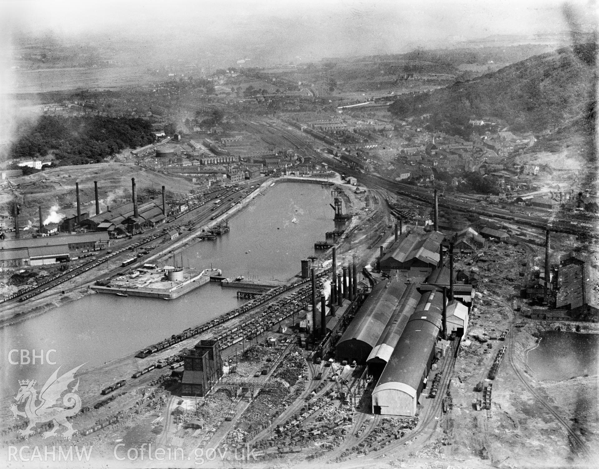 View of Briton Ferry showing the docks and steelworks, oblique aerial view. 5?x4? black and white glass plate negative.