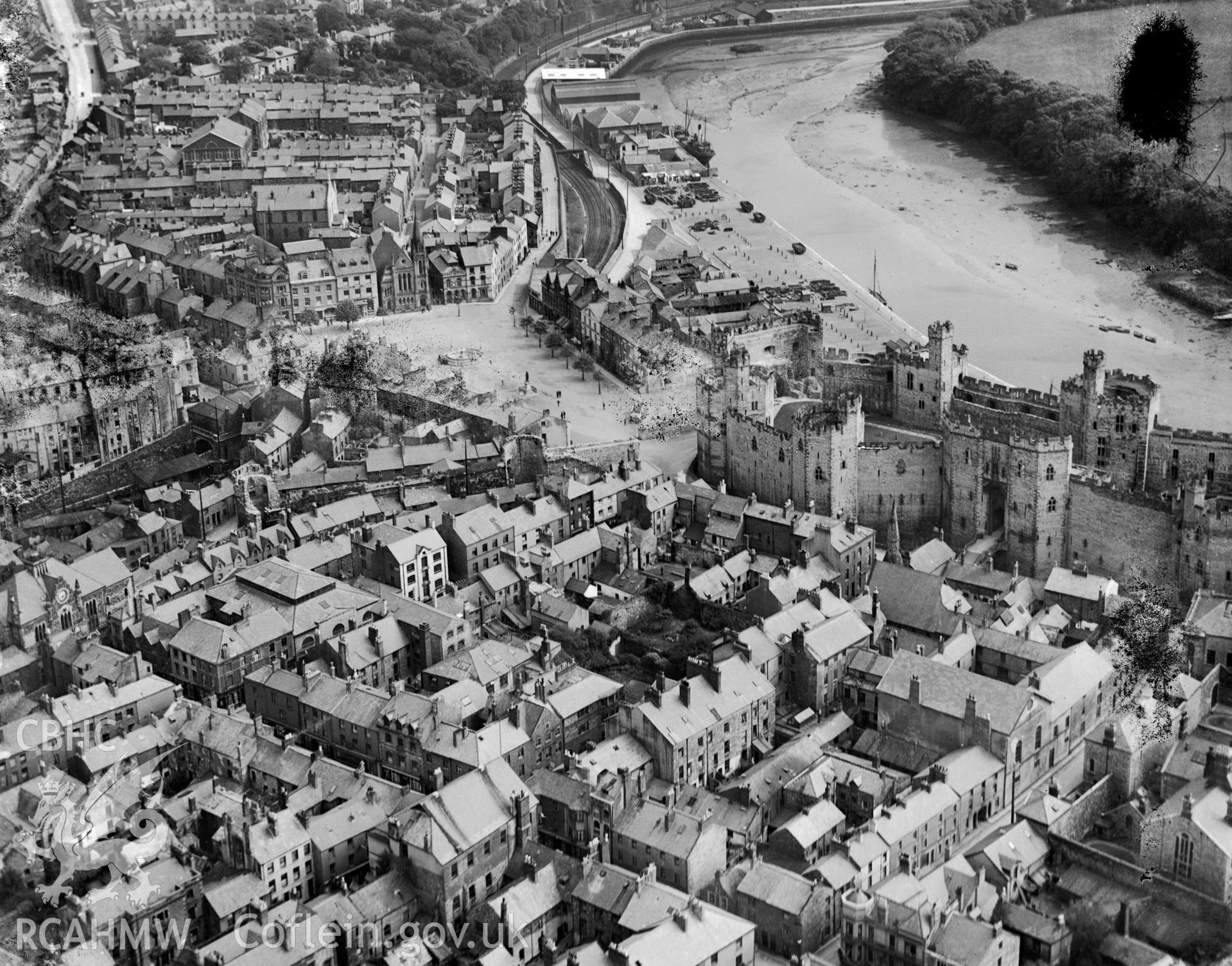 View of Caernarfon showing Castle, oblique aerial view. 5?x4? black and white glass plate negative.