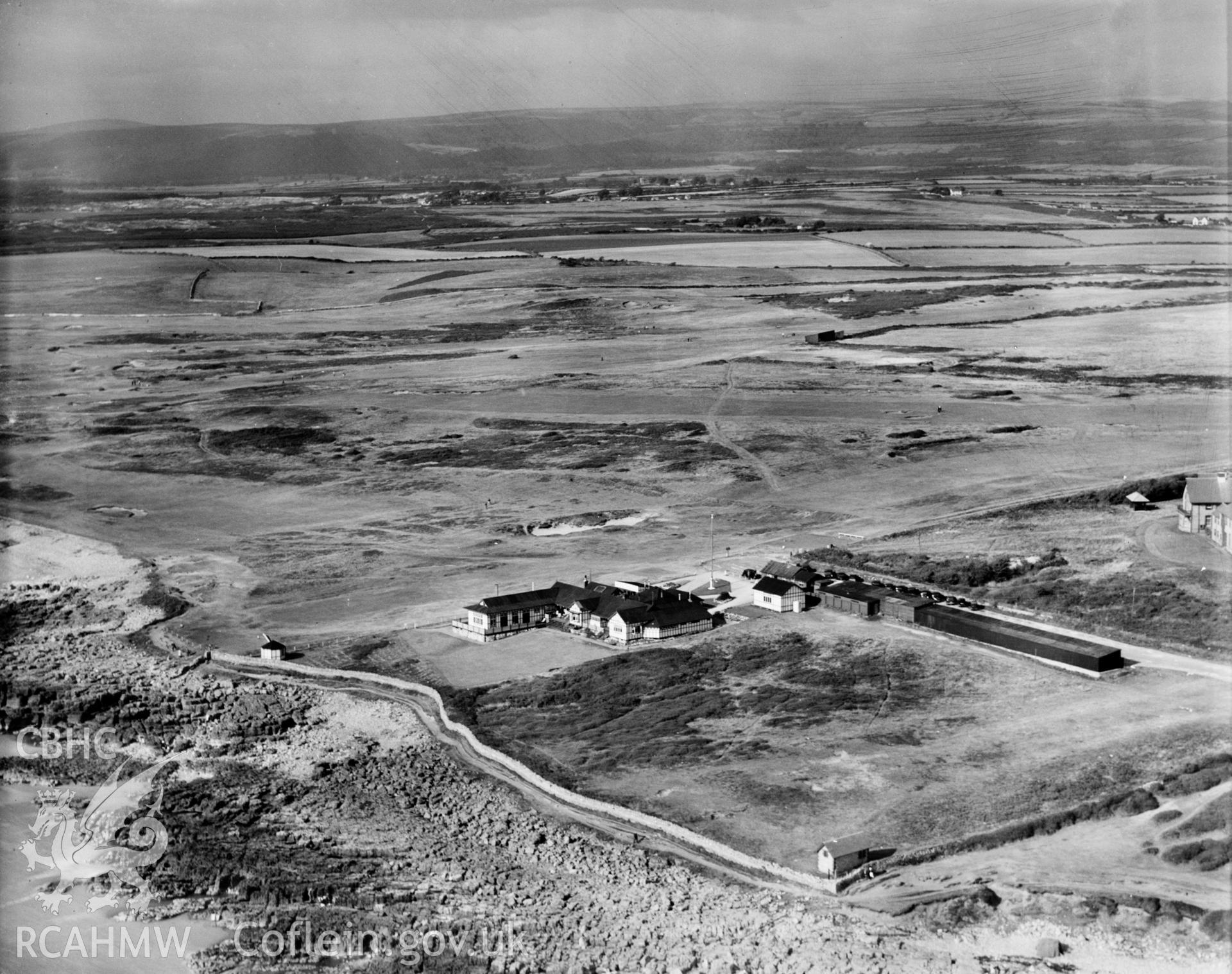 View of Ogmore-by-Sea, showing Southerndown golf course, oblique aerial view. 5?x4? black and white glass plate negative.