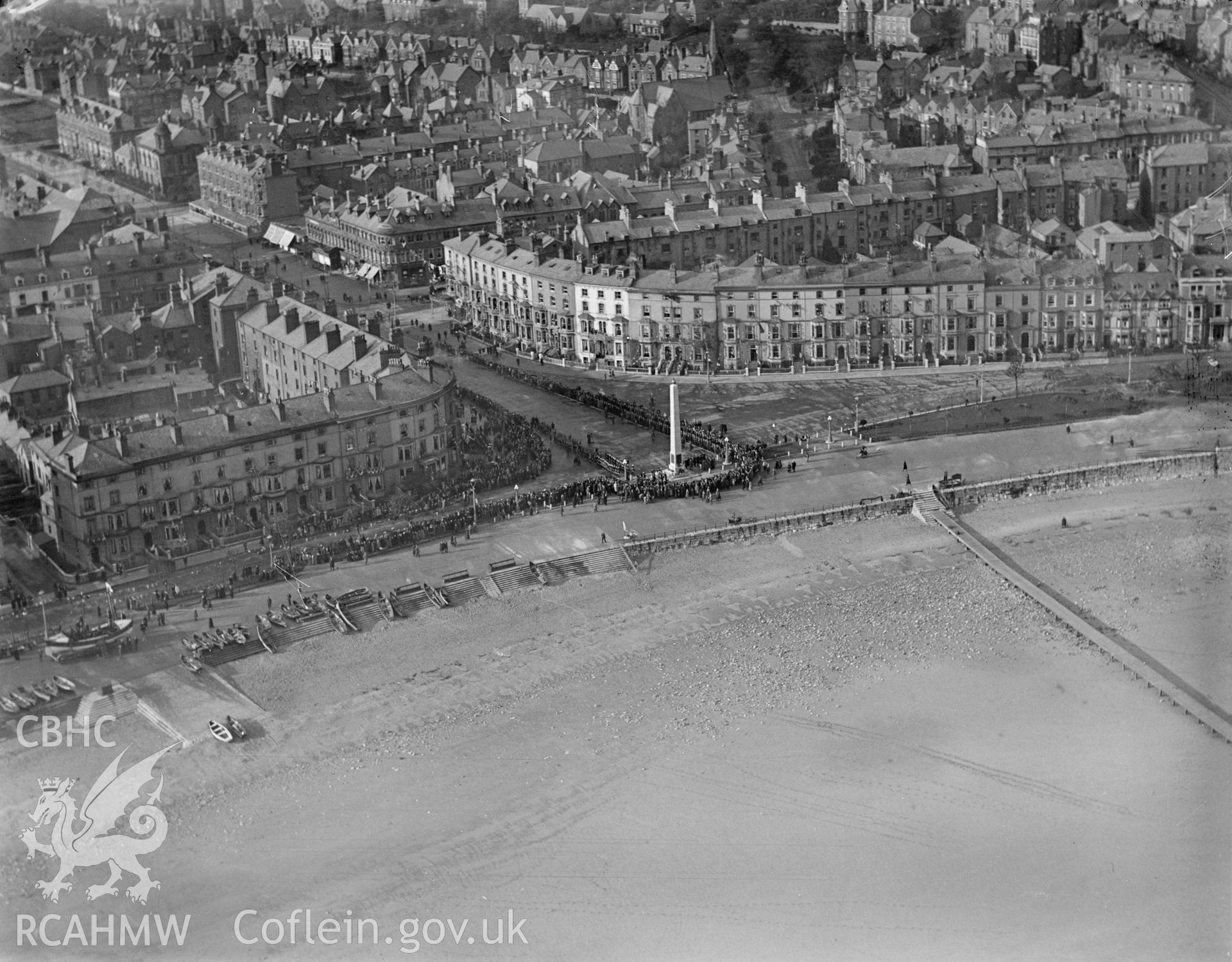 Llandudno, showing the Cenotaph war memorial during ceremony, oblique aerial view. 5?x4? black and white glass plate negative.